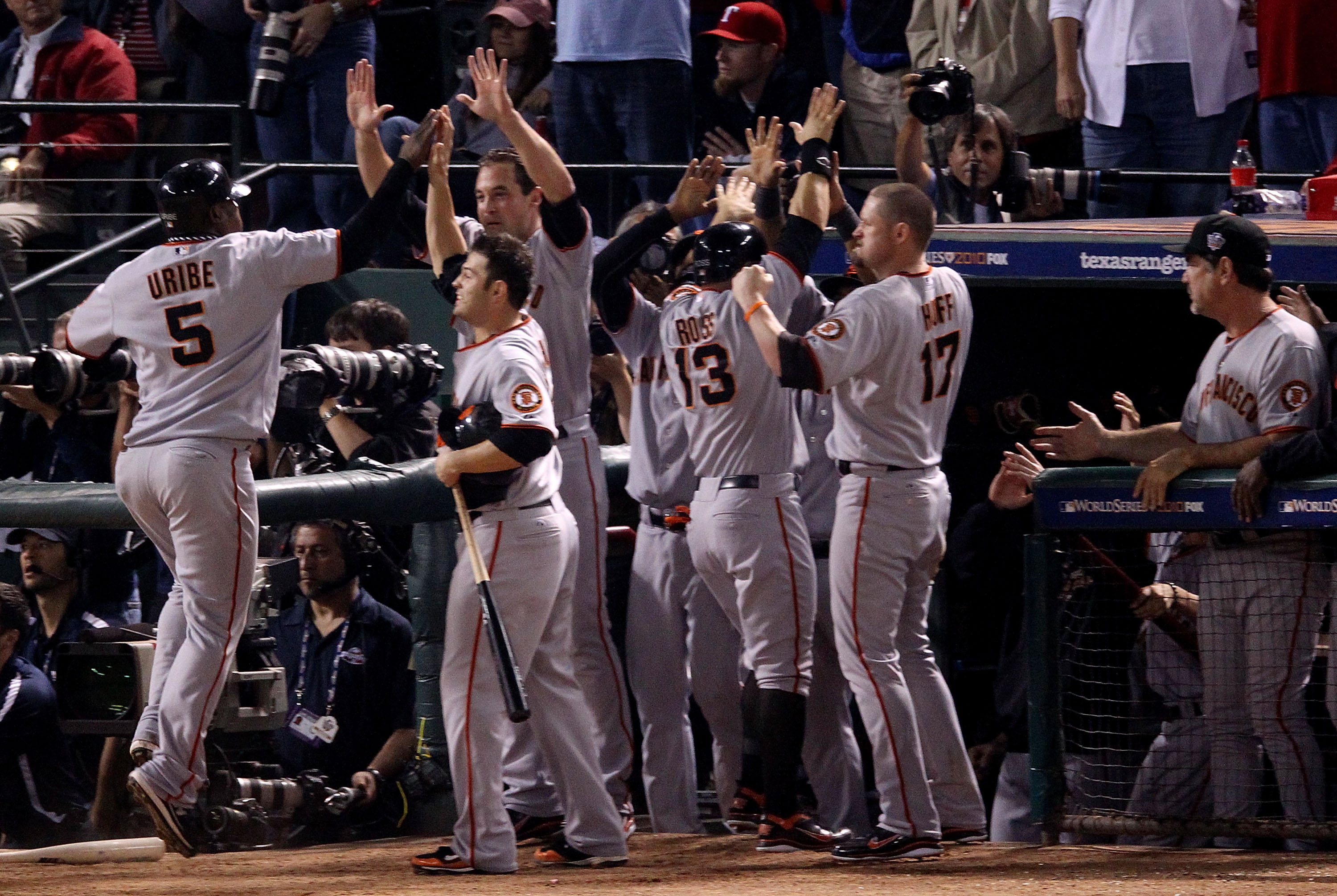 ARLINGTON, TX - NOVEMBER 01:  Edgar Renteria #16 of the San Francisco Giants celebrates with teammates after hitting a 3-run homer to centerfield against the Texas Rangers in the top of the seventh inning of Game Five of the 2010 MLB World Series at Range
