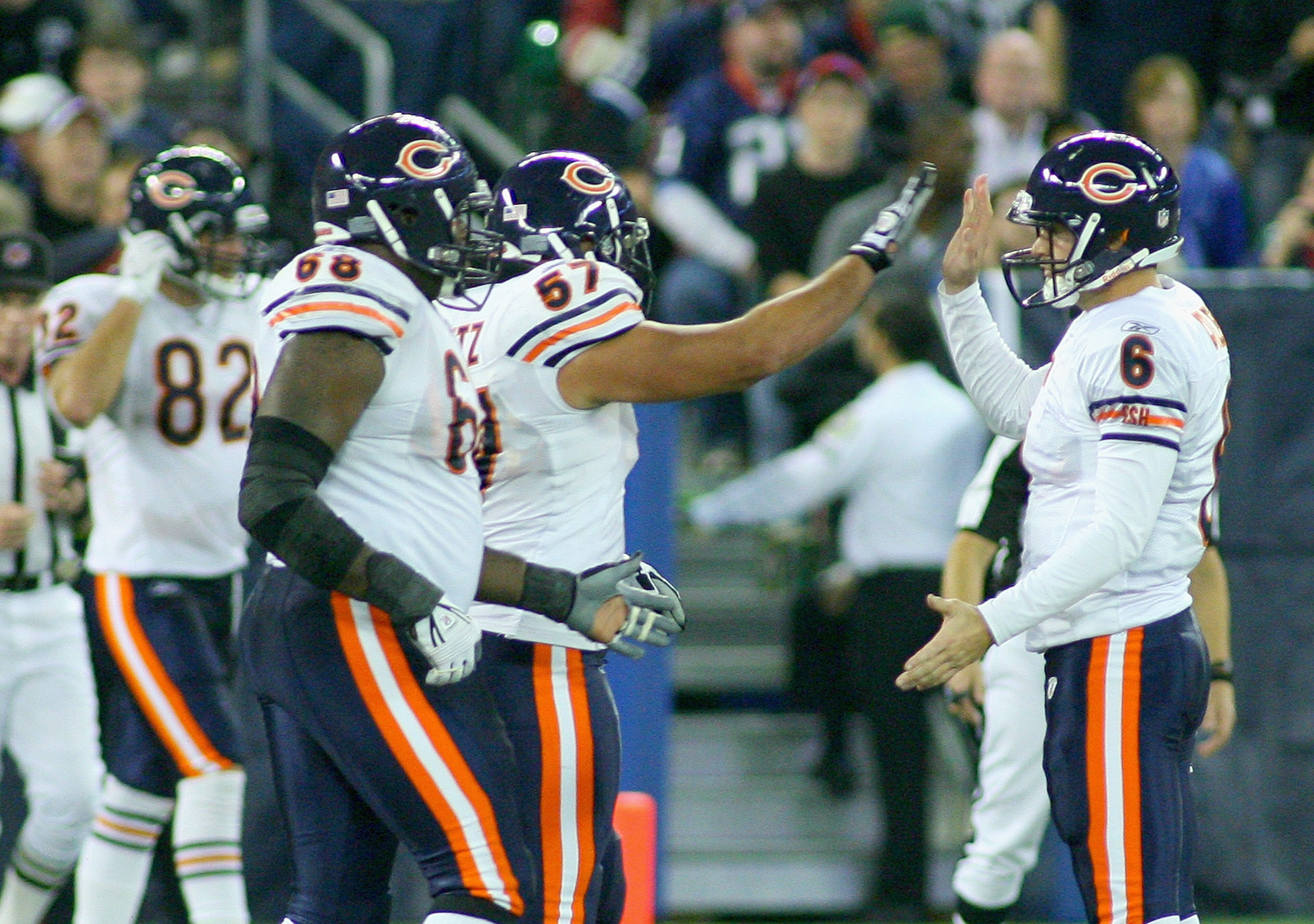 TORONTO, ON - NOVEMBER 07: Jay Cutler #6 and Olin Kreutz #57  of the Chicago Bears celebrate Earl Bennett's game winning touchdown against the Buffalo Bills  at Rogers Centre on November 7, 2010 in Toronto, Canada. Chicago won 22-19. (Photo by Rick Stewar