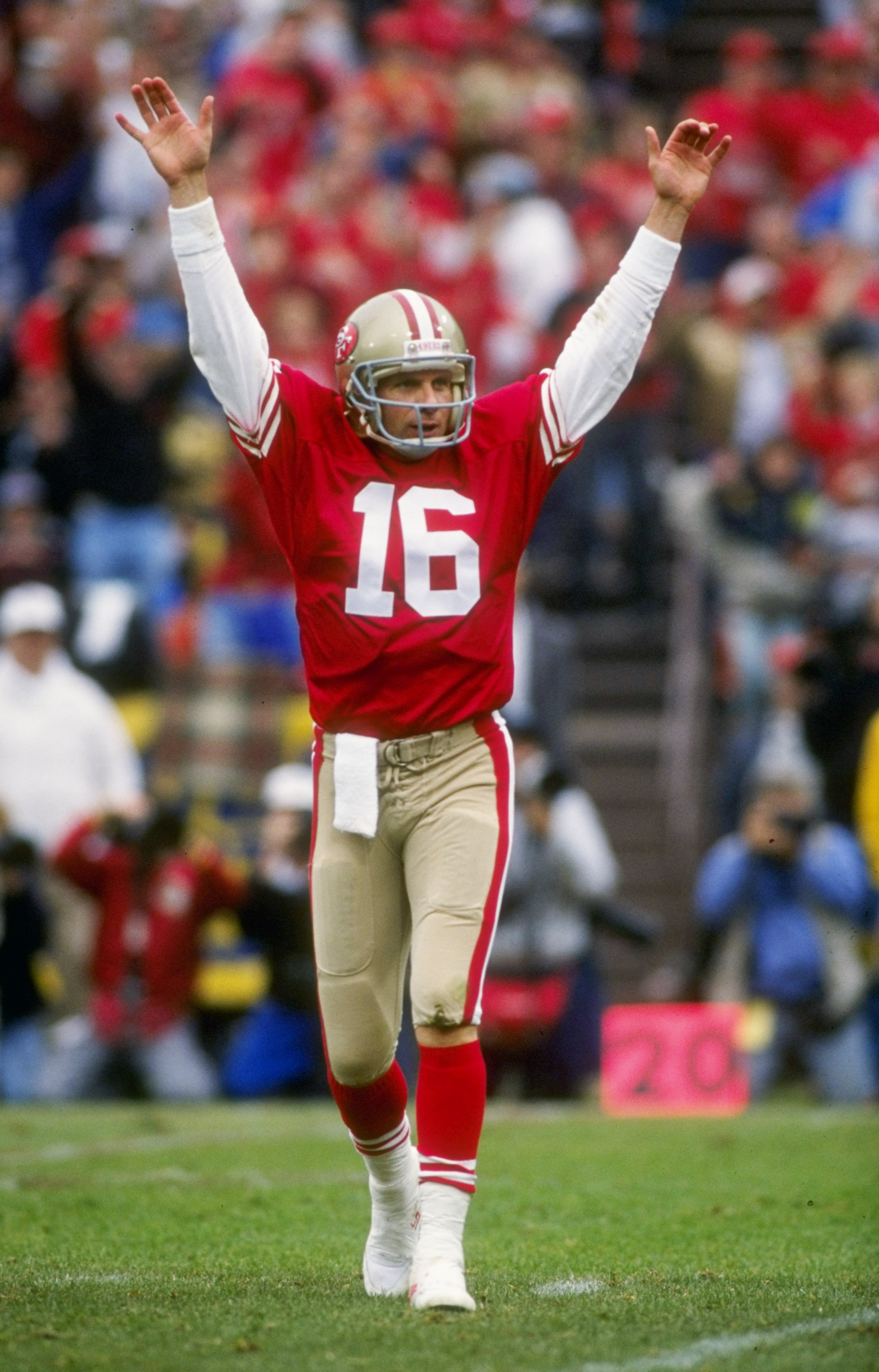 13 Jan 1991:  Quarterback Joe Montana of the San Francisco 49ers raises his hands in celebration after throwing a touch down pass in the 49ers 28-10 victory over the Washington Redskins at RFK Stadium in Washington D.C. Mandatory Credit: Otto Greule Jr.