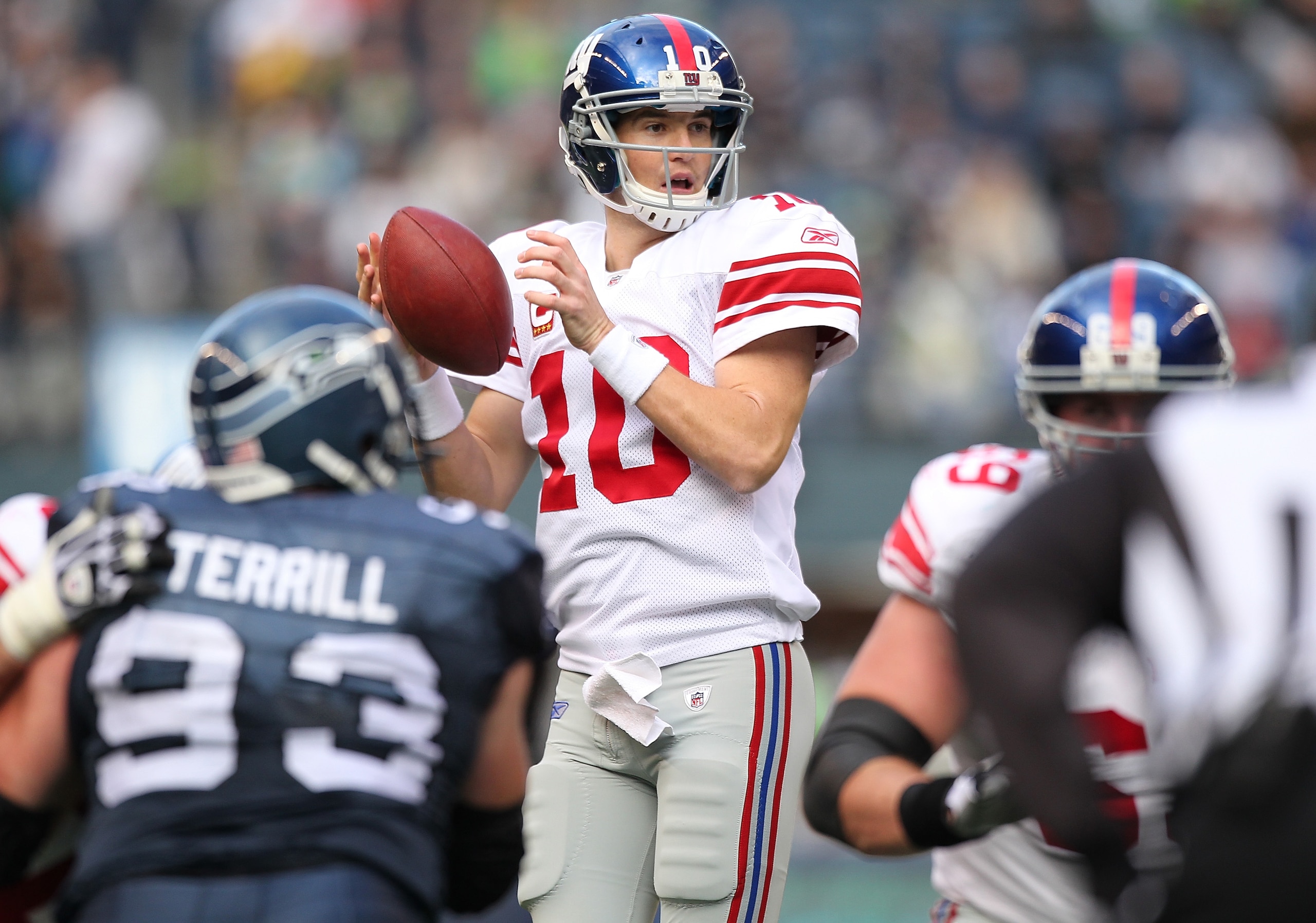 SEATTLE - NOVEMBER 07:  Quarterback Eli Manning #10 of the New York Giants takes the snap during the game against the Seattle Seahawks at Qwest Field on November 7, 2010 in Seattle, Washington. The Giants defeated the Seahawks 41-7. (Photo by Otto Greule