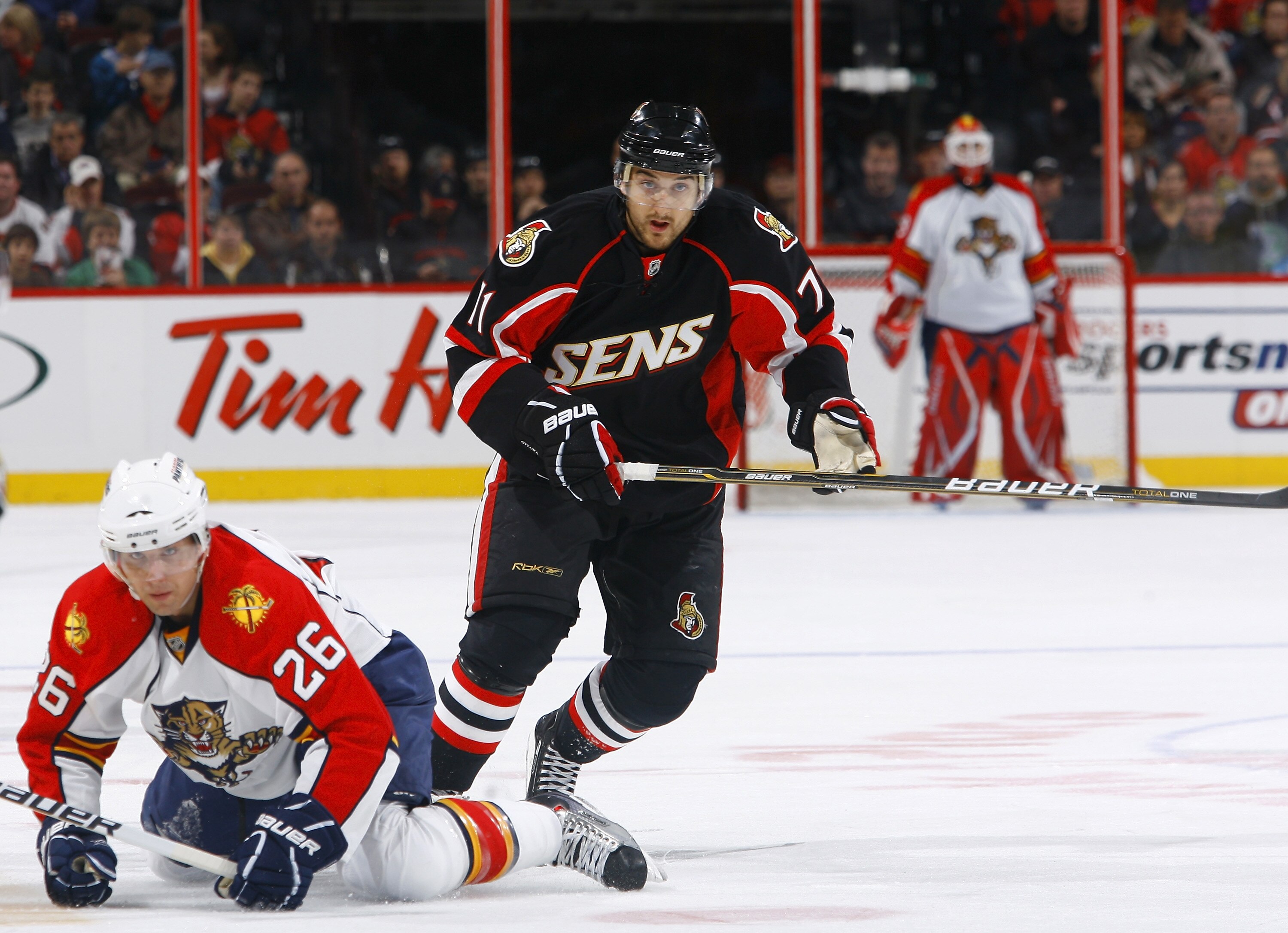 OTTAWA, ON - OCTOBER 28:  Nick Foligno #71 of the Ottawa Senators runs over Steve Bernier #26 of the Florida Panthers while skating back up ice during a game at Scotiabank Place on October 28, 2010 in Ottawa, Ontario, Canada.  (Photo by Phillip MacCallum/