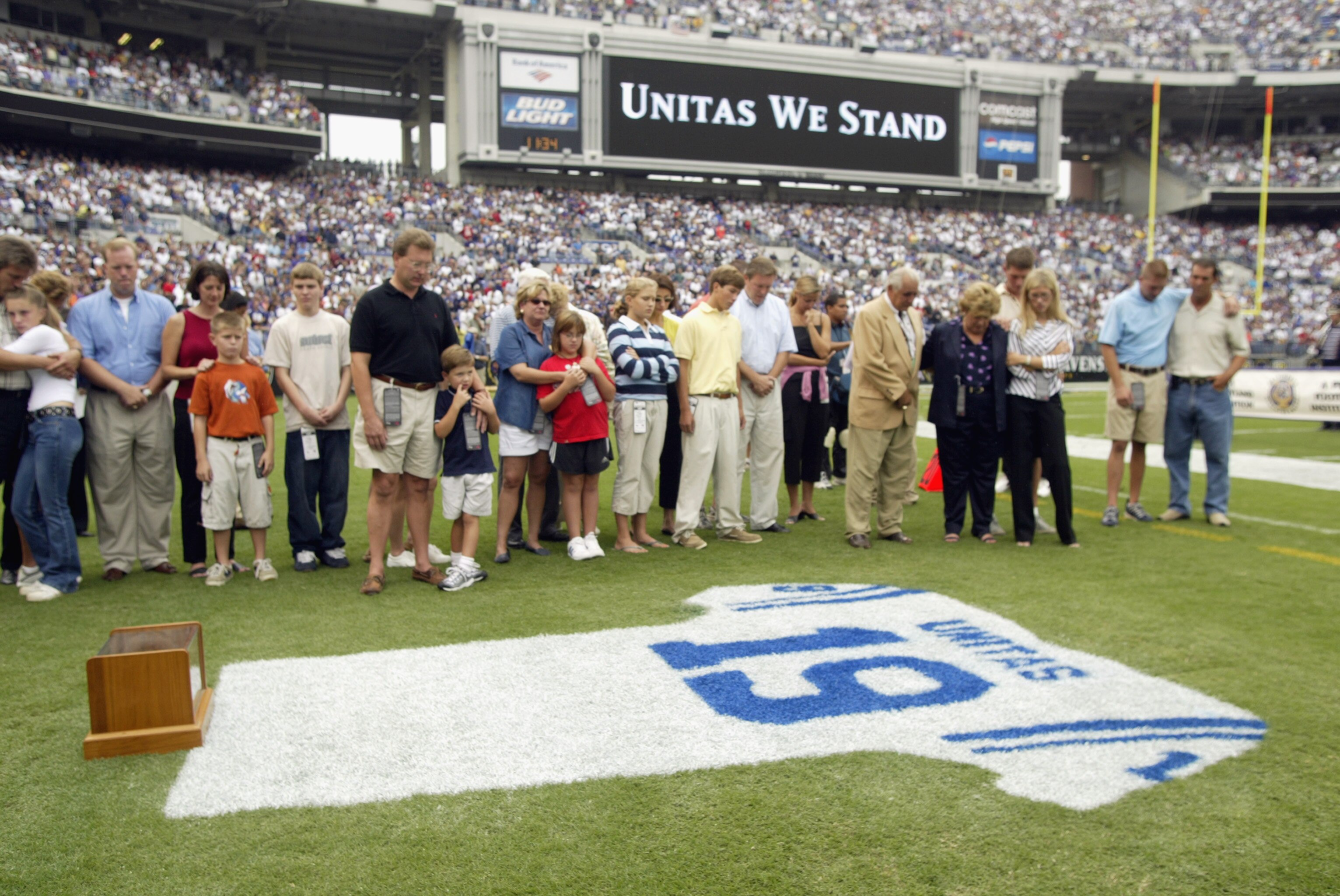 BALTIMORE - SEPTEMBER  15:  The family of Hall of Fame quarterback Johnny Unitas #19 of the Baltimore Colts, wife Sandra; sons John Jr., Kenneth, Robert, Christopher, Joe and Chad; and daughters Janice Ann Unitas-DeNittis and Paige Unitas stand over a tri