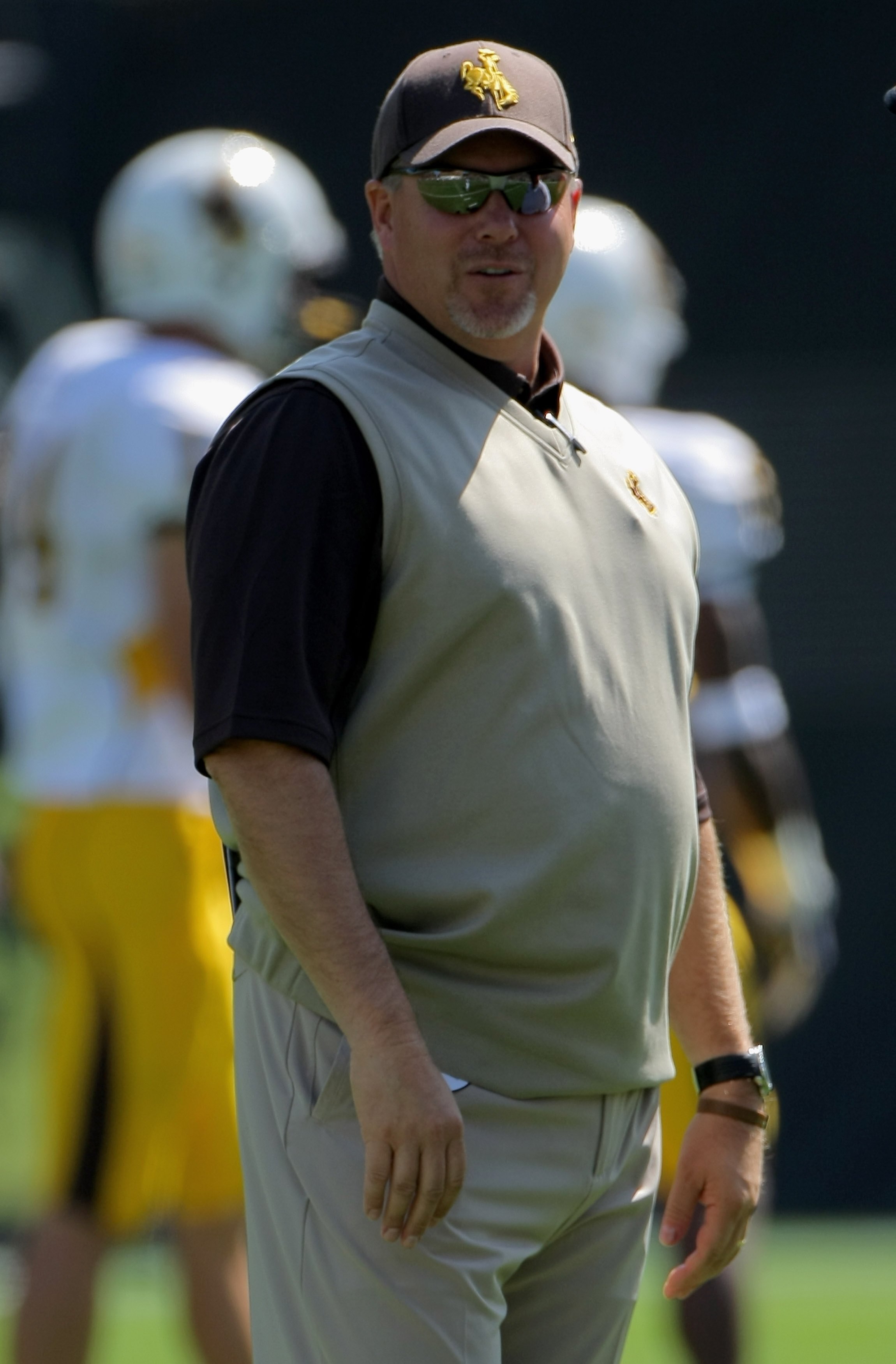 BOULDER, CO - SEPTEMBER 19:  Head coach Dave Christensen of the Wyoming Cowboys prepares to lead his team against the Colorado Buffaloes at Folsom Field on September 19, 2009 in Boulder, Colorado. The Buffaloes defeated the Cowboys 24-0.  (Photo by Doug P