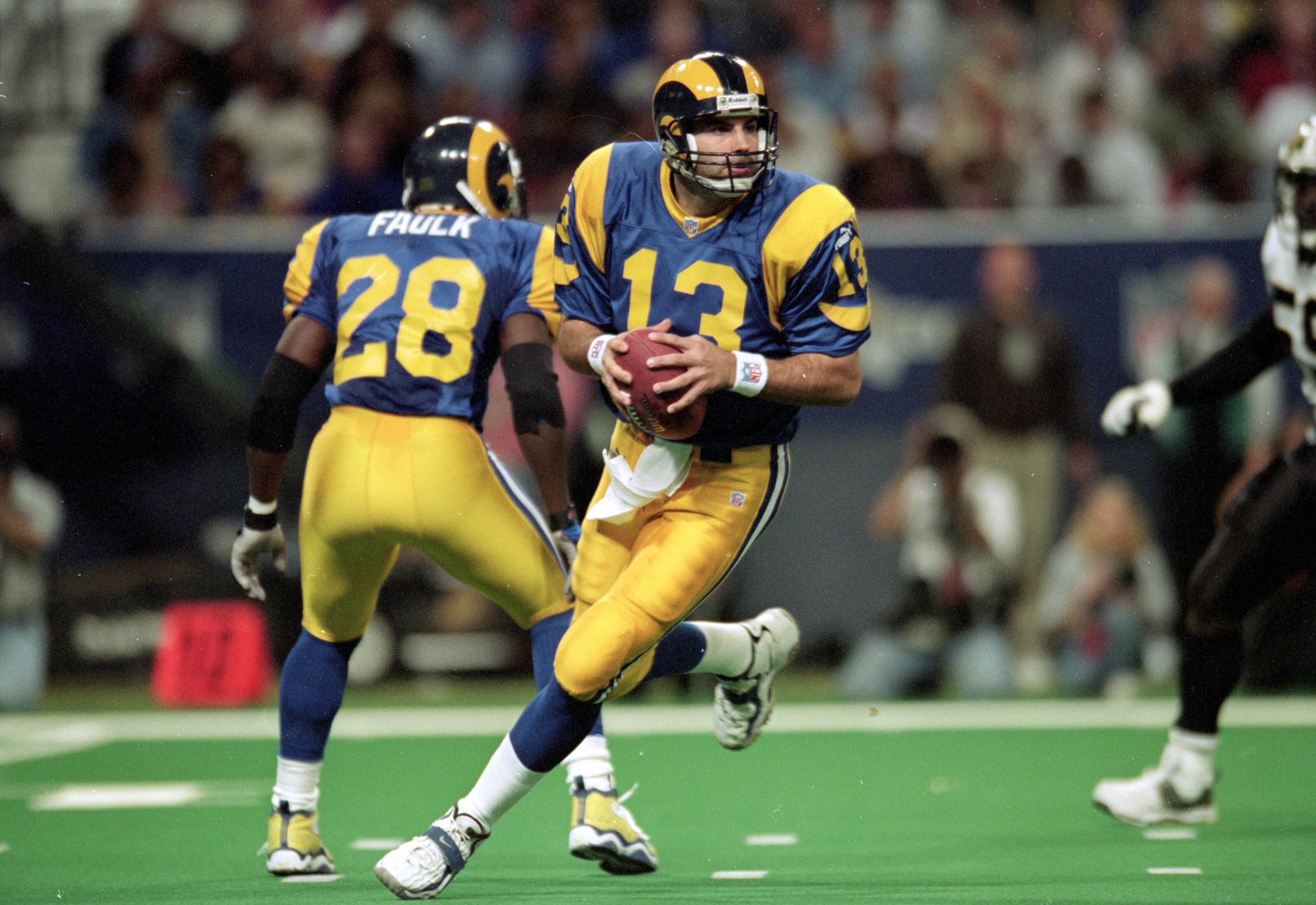 28 Nov 1999: Kurt Warner #13 of the St. Louis Rams runs to pass the ball during a game against the New Orleans Saints at the Trans World Dome in St. Louis, Missouri. The Rams defeated the Saints 43-12. Mandatory Credit: Elsa Hasch  /Allsport