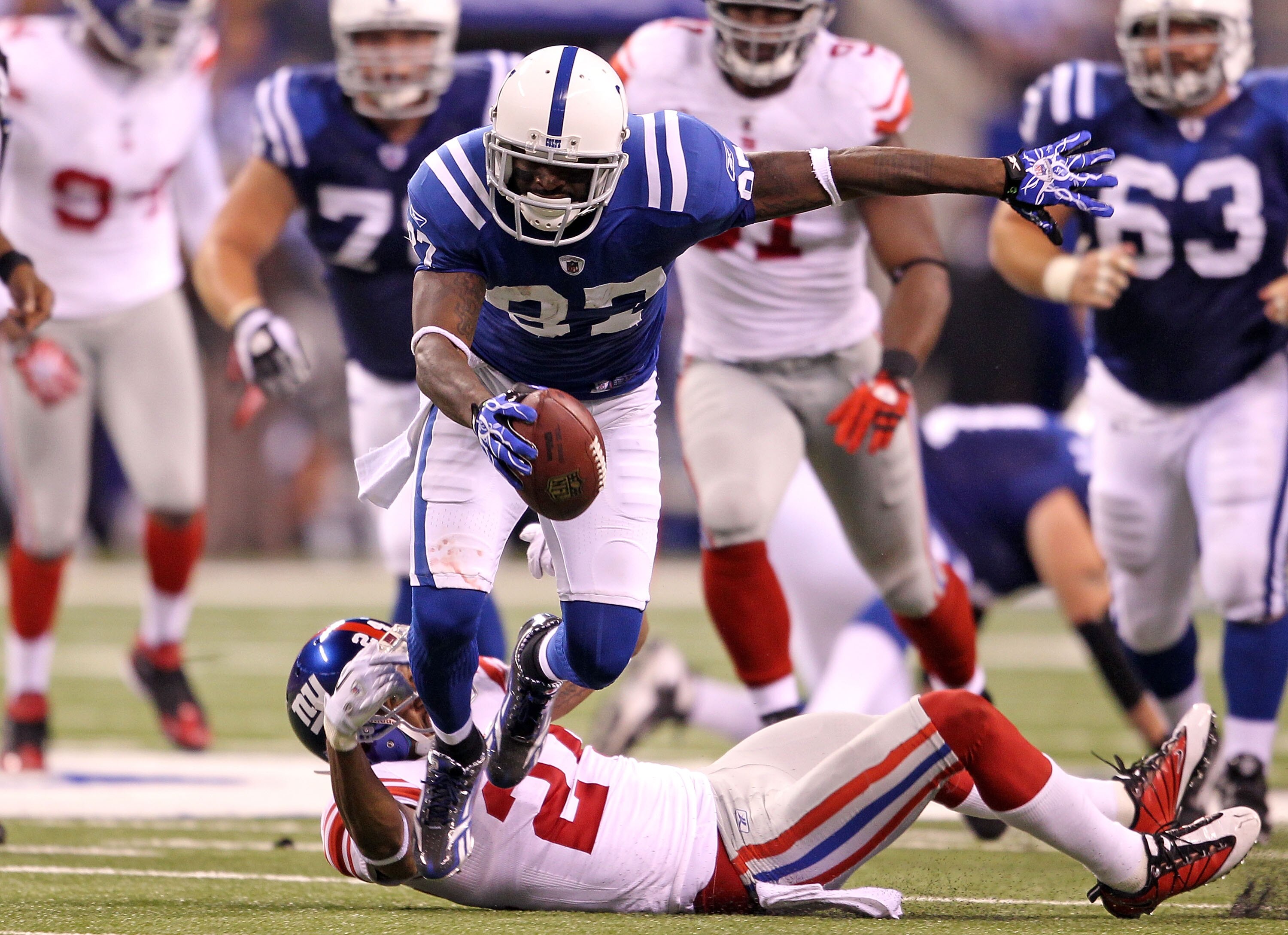 INDIANAPOLIS - SEPTEMBER 19:  Reggie Wayne #87 of the Indianapolis Colts runs with the ball during the NFL game against the New York Giants  at Lucas Oil Stadium on September 19, 2010 in Indianapolis, Indiana.  (Photo by Andy Lyons/Getty Images)