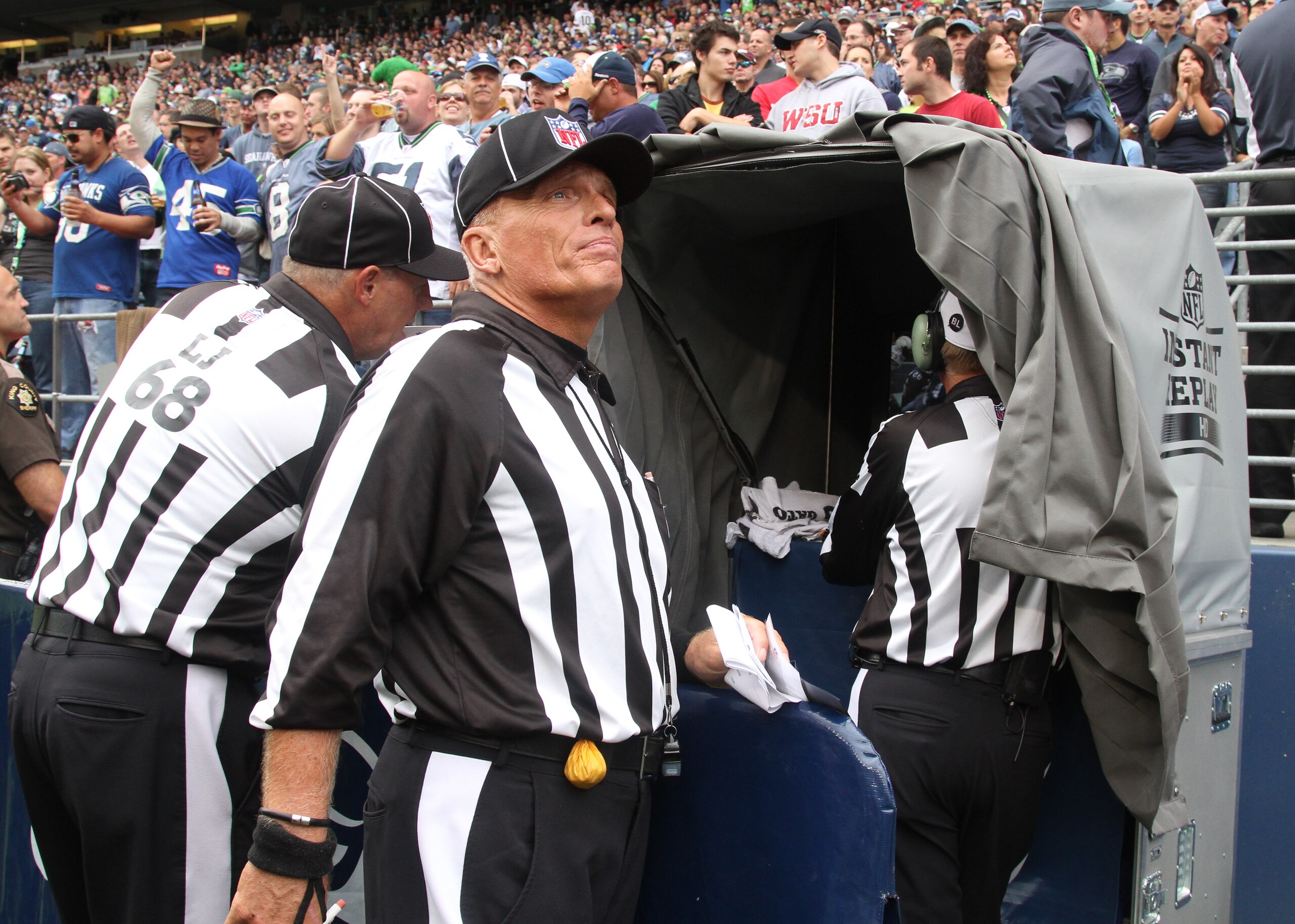 SEATTLE - SEPTEMBER 26:  Referees review a play during the game between the Seattle Seahawks and the San Diego Chargers at Qwest Field on September 26, 2010 in Seattle, Washington. (Photo by Otto Greule Jr/Getty Images)