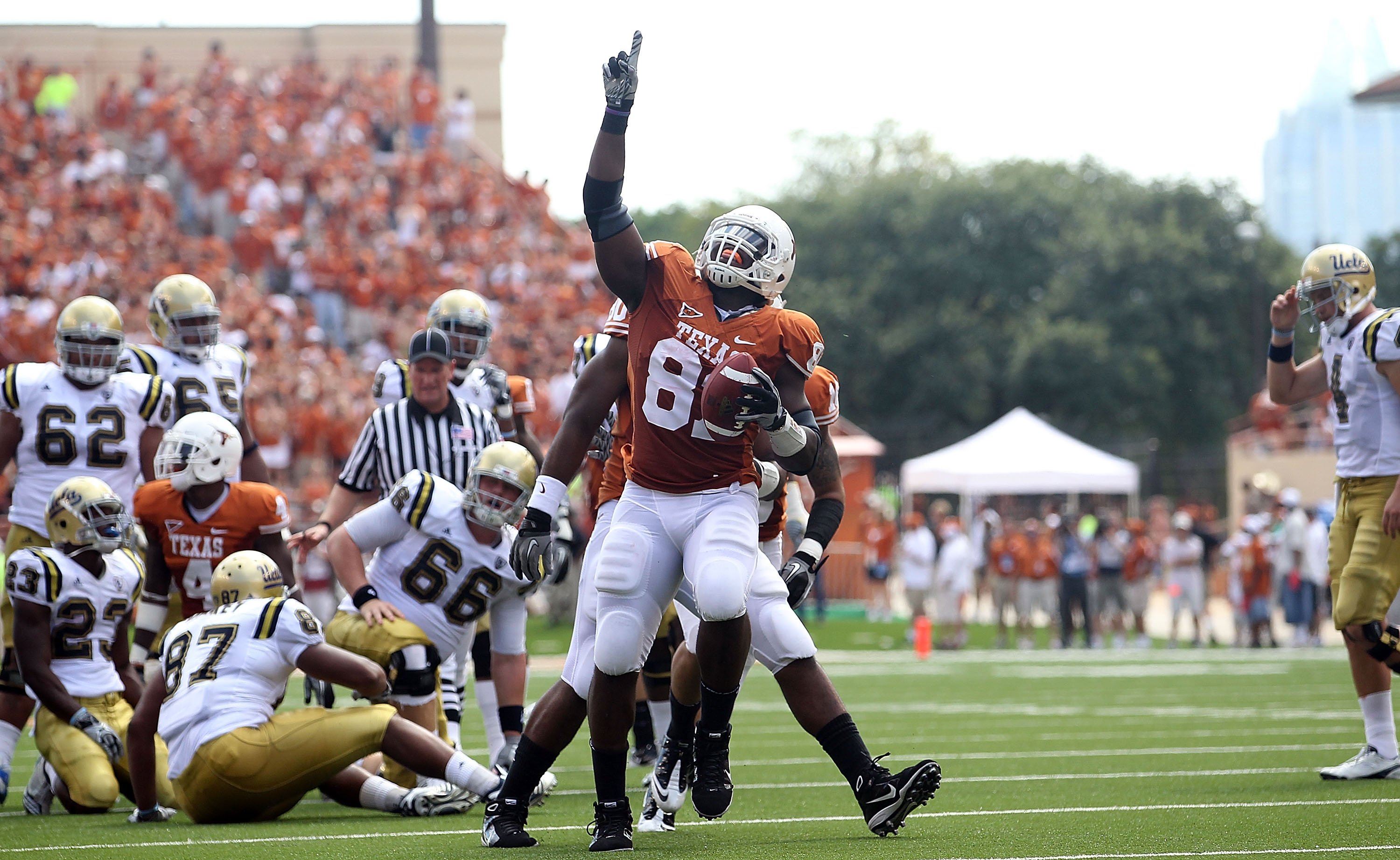 AUSTIN, TX - SEPTEMBER 25: Defensive end Sam Acho #81 of the Texas Longhorns reacts after making a fumble recovery against the UCLA Bruins at Darrell K Royal-Texas Memorial Stadium on September 25, 2010 in Austin, Texas. (Photo by Ronald Martinez/Getty AUSTIN, TX - SEPTEMBER 25: Defensive end Sam Acho #81 of the Texas Longhorns reacts after making a fumble recovery against the UCLA Bruins at Darrell K Royal-Texas Memorial Stadium on September 25, 2010 in Austin, Texas. (Photo by Ronald Martinez/Getty