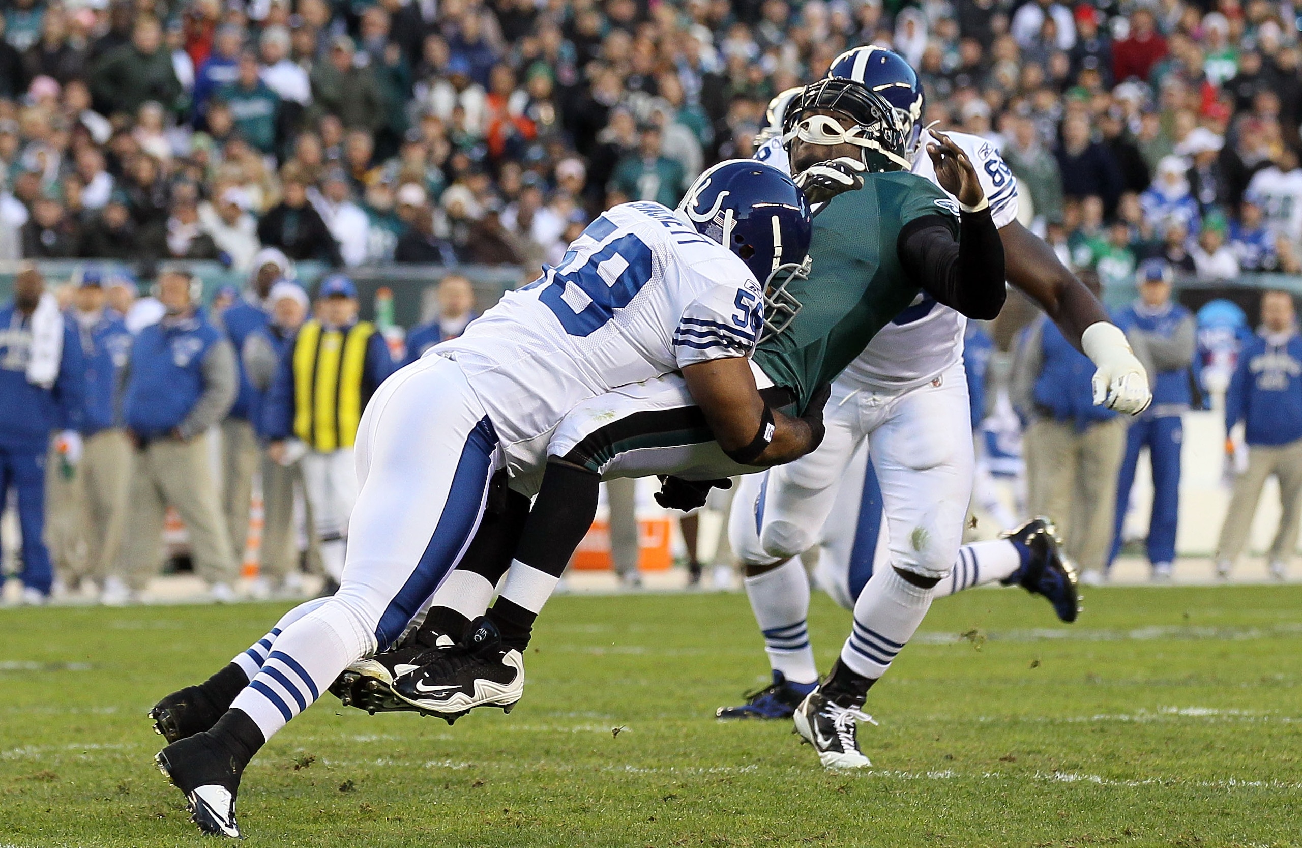 PHILADELPHIA - NOVEMBER 07:  Michael Vick #7 of the Philadelphia Eagles is hit hard by Gary Brackett #58 of the Indianapolis Colts after throwing a pass on November 7, 2010 at Lincoln Financial Field in Philadelphia, Pennsylvania.  (Photo by Jim McIsaac/G