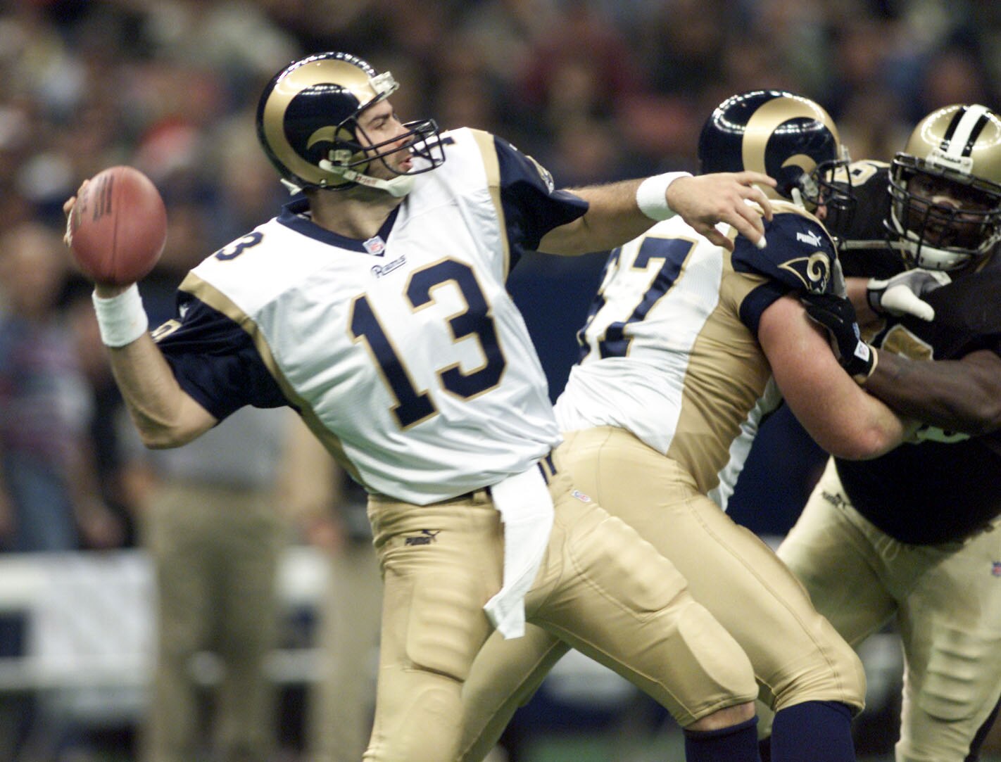 24 Dec 2000:  Quarterback Kurt Warner #13 of the St. Louis Rams throws a pass during Sunday's final regular season game against the New Orleans Saints at the Louisiana Superdome in New Orleans, Louisiana.  Digital Image.  The Rams defeated the Saints with