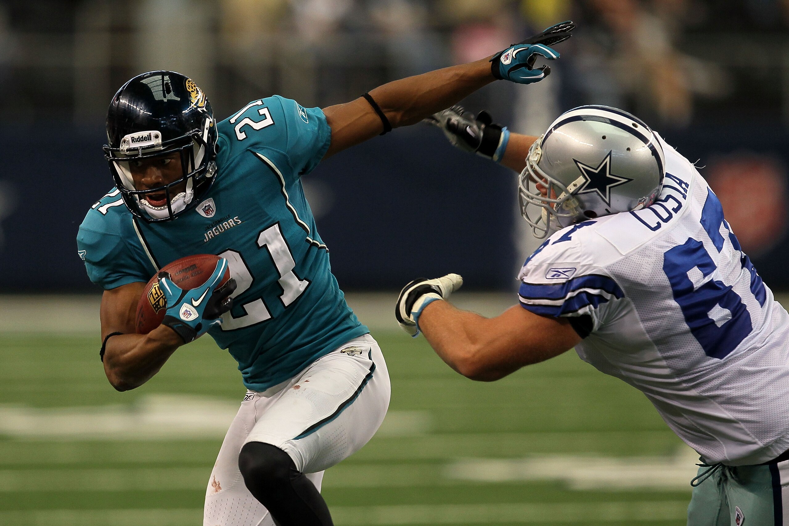 ARLINGTON, TX - OCTOBER 31:  Derek Cox #21 of the Dallas Cowboys returns an interception for positive yards in the third quarter against the Jacksonville Jaguars at Cowboys Stadium on October 31, 2010 in Arlington, Texas.  (Photo by Stephen Dunn/Getty Ima