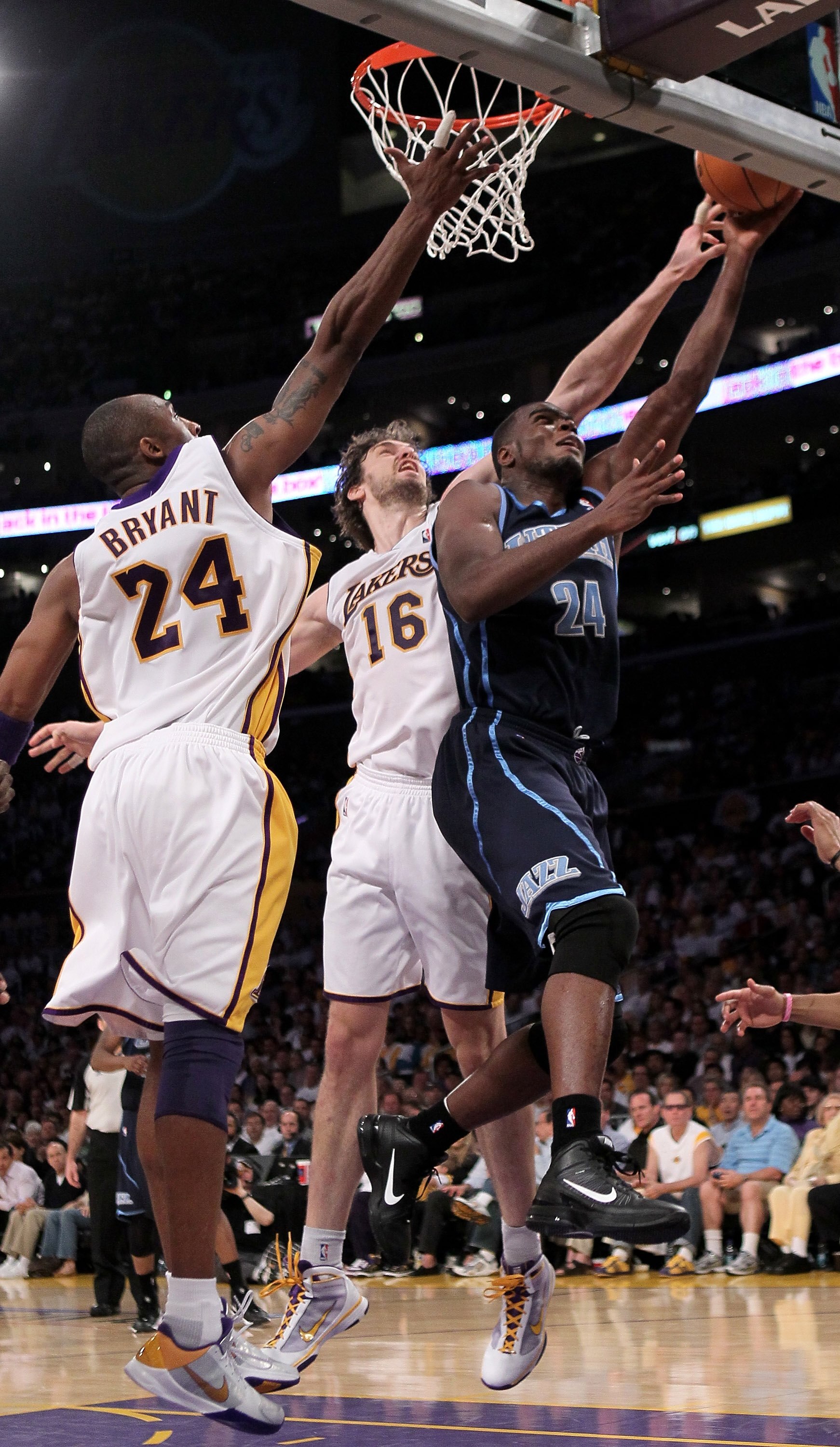 LOS ANGELES, CA - MAY 02:  Paul Millsap #24 of the Utah Jazz shoots over Pau Gasol #16 and Kobe Bryant #24 of the Los Angeles Lakers during Game One of the Western Conference Semifinals of the 2010 NBA Playoffs on May 2, 2010 at Staples Center in Los Ange