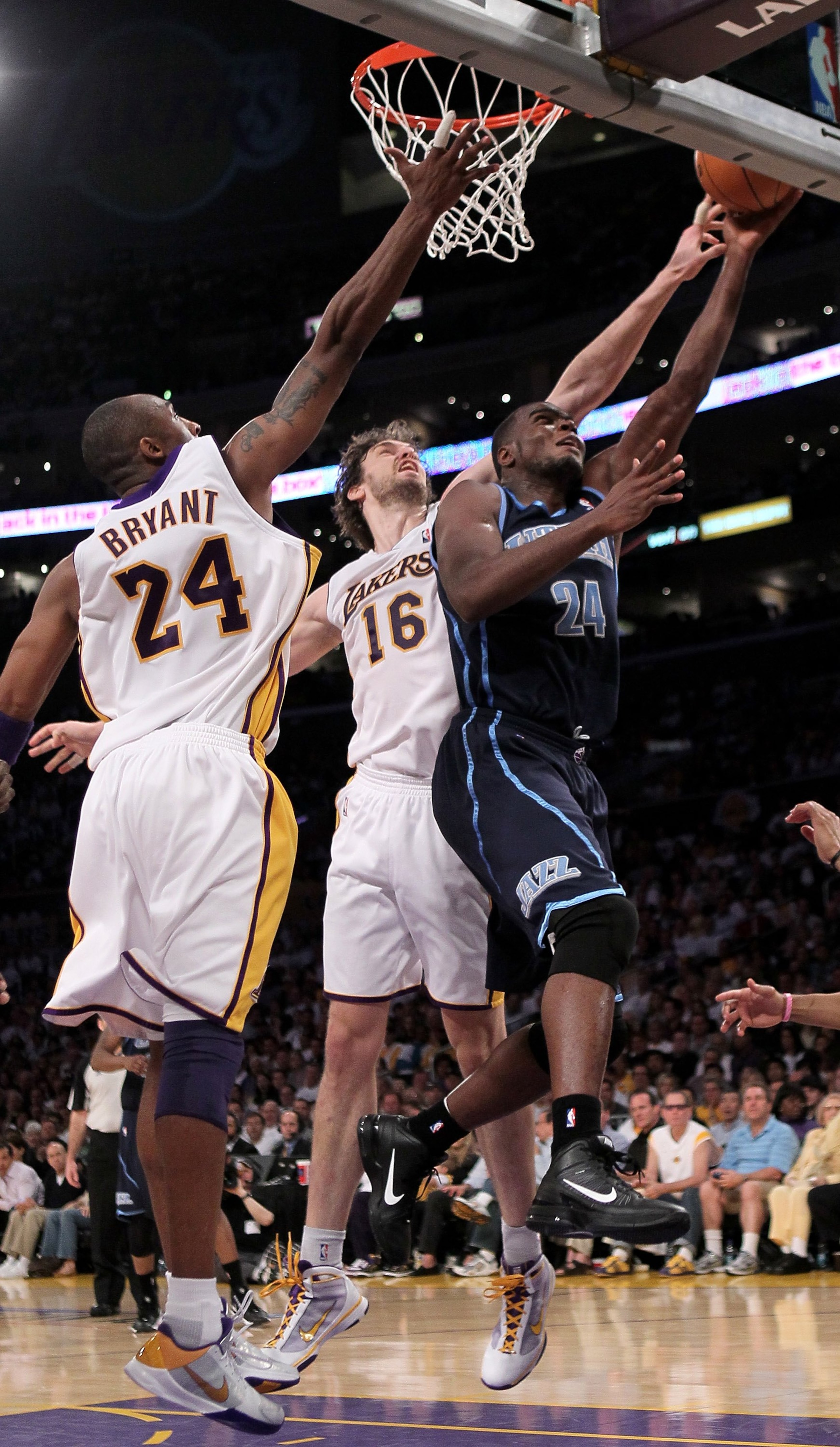 LOS ANGELES, CA - MAY 02: Paul Millsap #24 of the Utah Jazz shoots over Pau Gasol #16 and Kobe Bryant #24 of the Los Angeles Lakers during Game One of the Western Conference Semifinals of the 2010 NBA Playoffs on May 2, 2010 at Staples Center in Los Ange LOS ANGELES, CA - MAY 02: Paul Millsap #24 of the Utah Jazz shoots over Pau Gasol #16 and Kobe Bryant #24 of the Los Angeles Lakers during Game One of the Western Conference Semifinals of the 2010 NBA Playoffs on May 2, 2010 at Staples Center in Los Ange