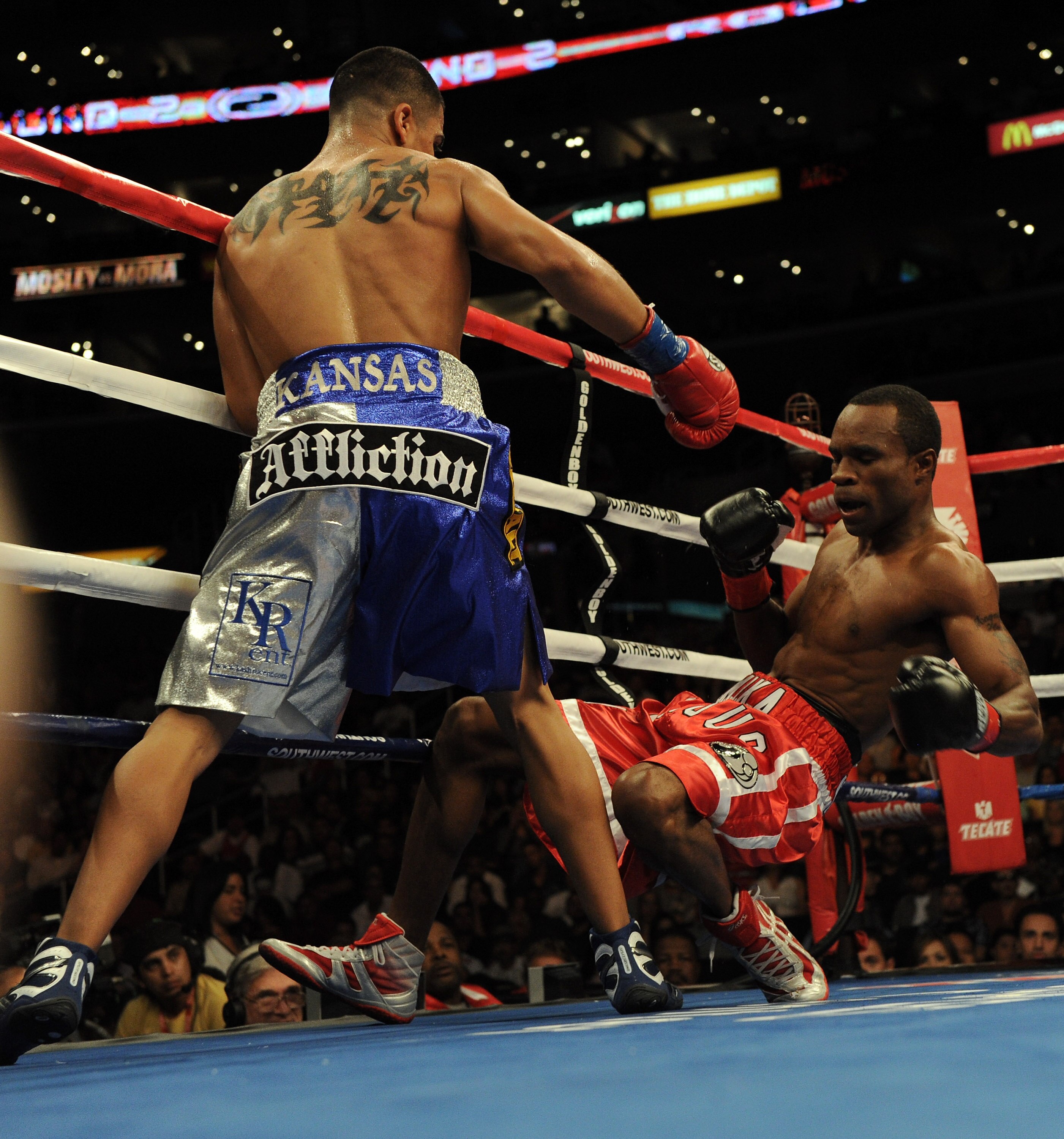 LOS ANGELES, CA - SEPTEMBER 18:  Victor Ortiz knocks down Vivian Harris during the second round in a Welterweight fight at Staples Center on September 18, 2010 in Los Angeles, California. Ortiz would win the fight in a third round knockout.  (Photo by Har