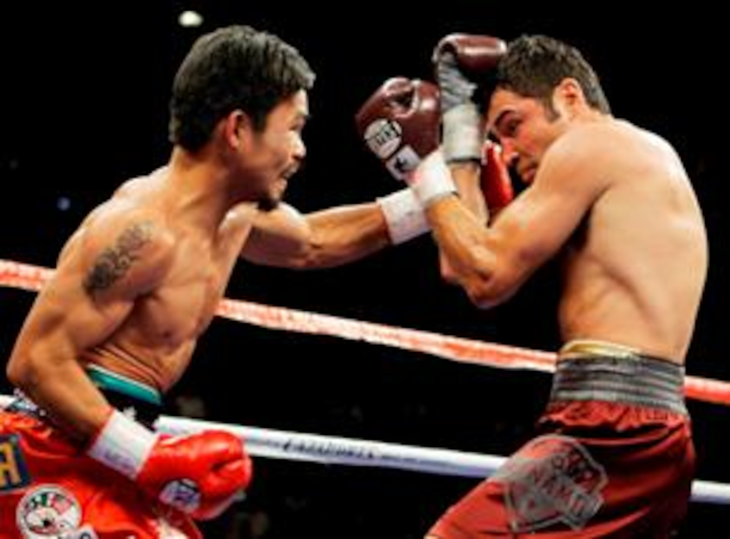 A weight drained Oscar De La Hoya is destroyed by the smaller Pacman