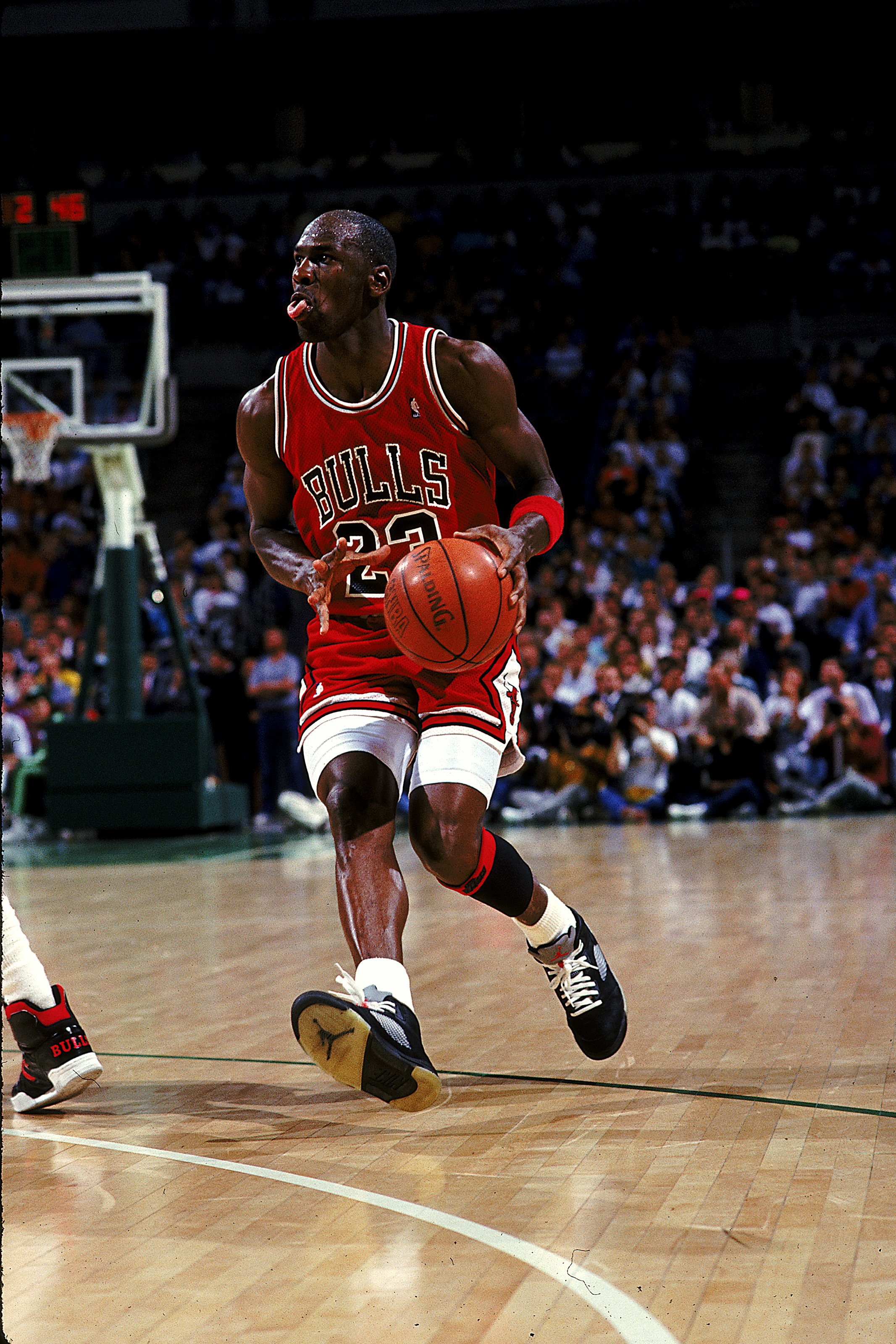1990:  Michael Jordan #23 of the Chicago Bulls moves with the ball during the game.   Mandatory Credit: Allsport  /Allsport