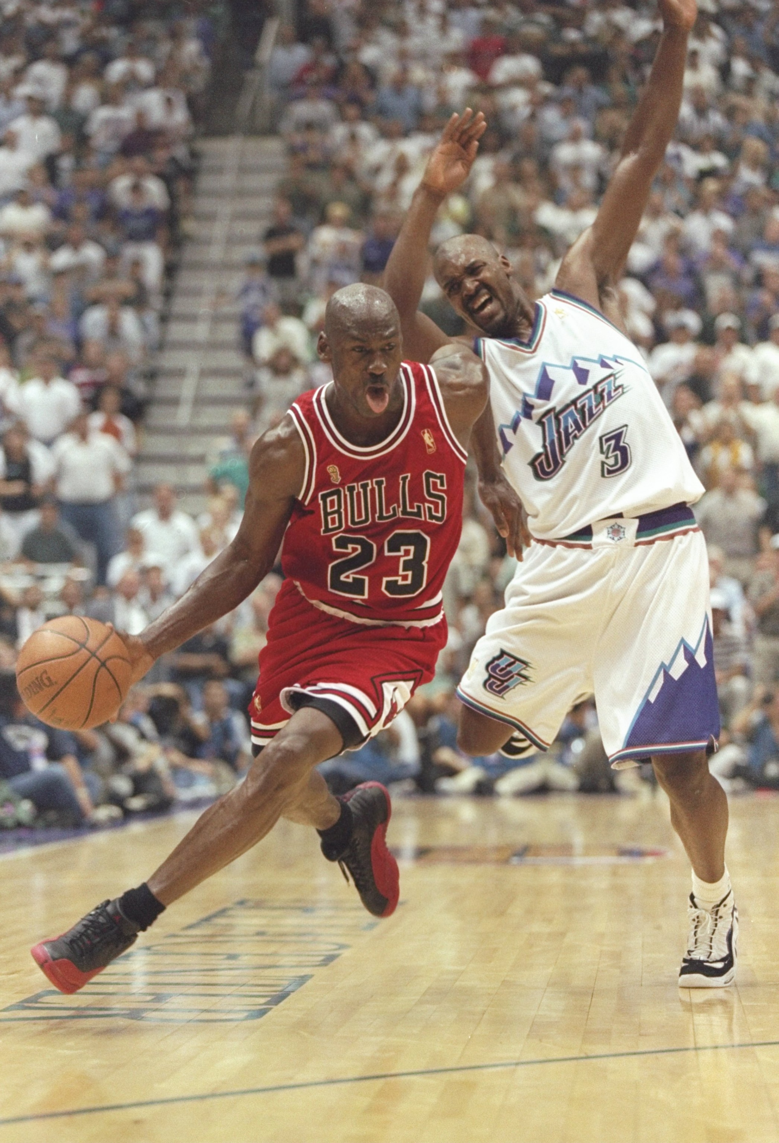 11 Jun 1997: Michael Jordan of the Chicago Bulls drives around Bryon Russell #3 of the Jazz during the Bulls 90-88 win over the Utah Jazz in Game 5 of the NBA Finals at the Delta Center in Salt Lake City, Utah. 11 Jun 1997: Michael Jordan of the Chicago Bulls drives around Bryon Russell #3 of the Jazz during the Bulls 90-88 win over the Utah Jazz in Game 5 of the NBA Finals at the Delta Center in Salt Lake City, Utah.