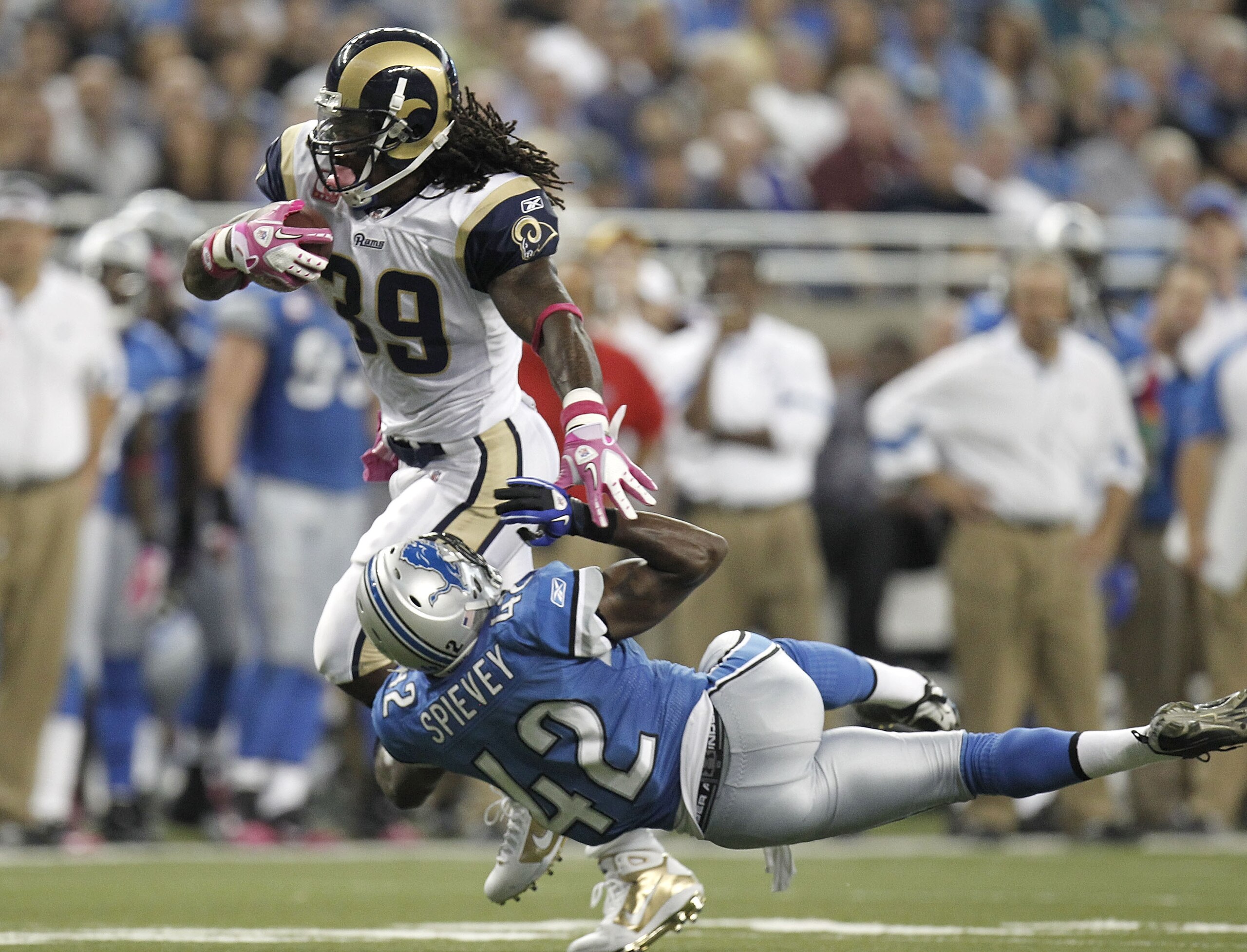 DETROIT - OCTOBER 10:  Steven Jackson #39 of the St. Louis Rams runs through the tackle of Amari Spievey #42 of the Detroit Lions on October 10, 2010 at Ford Field in Detroit, Michigan.  (Photo by Gregory Shamus/Getty Images)