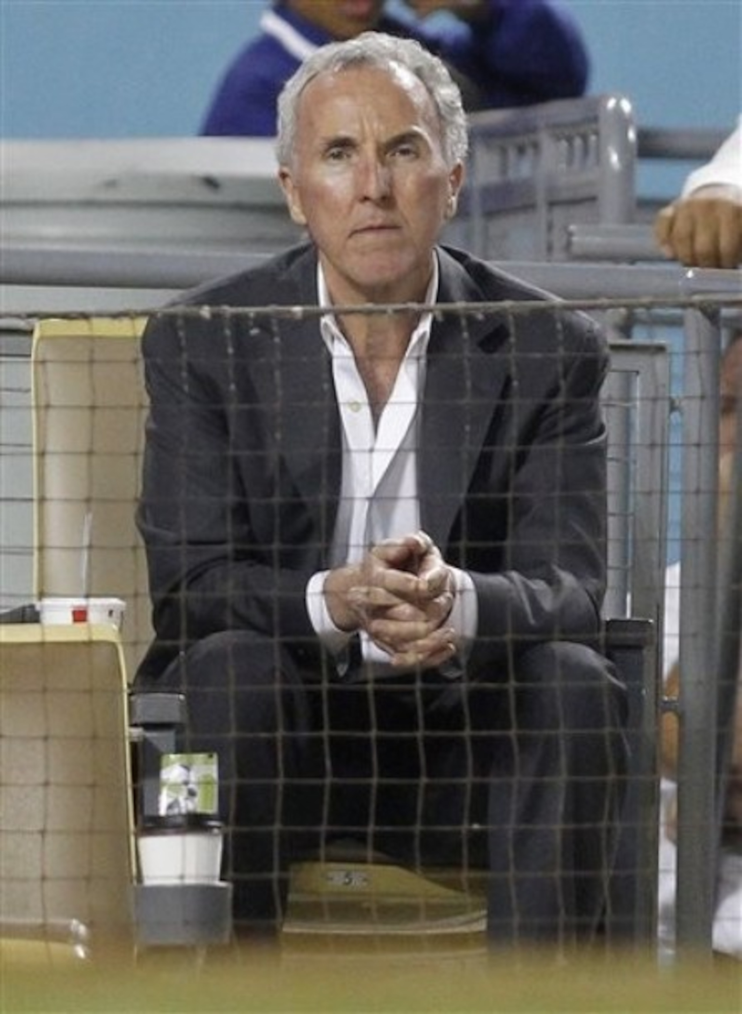 Dodgers owner Frank McCourt looks on at his team and its unknown future.