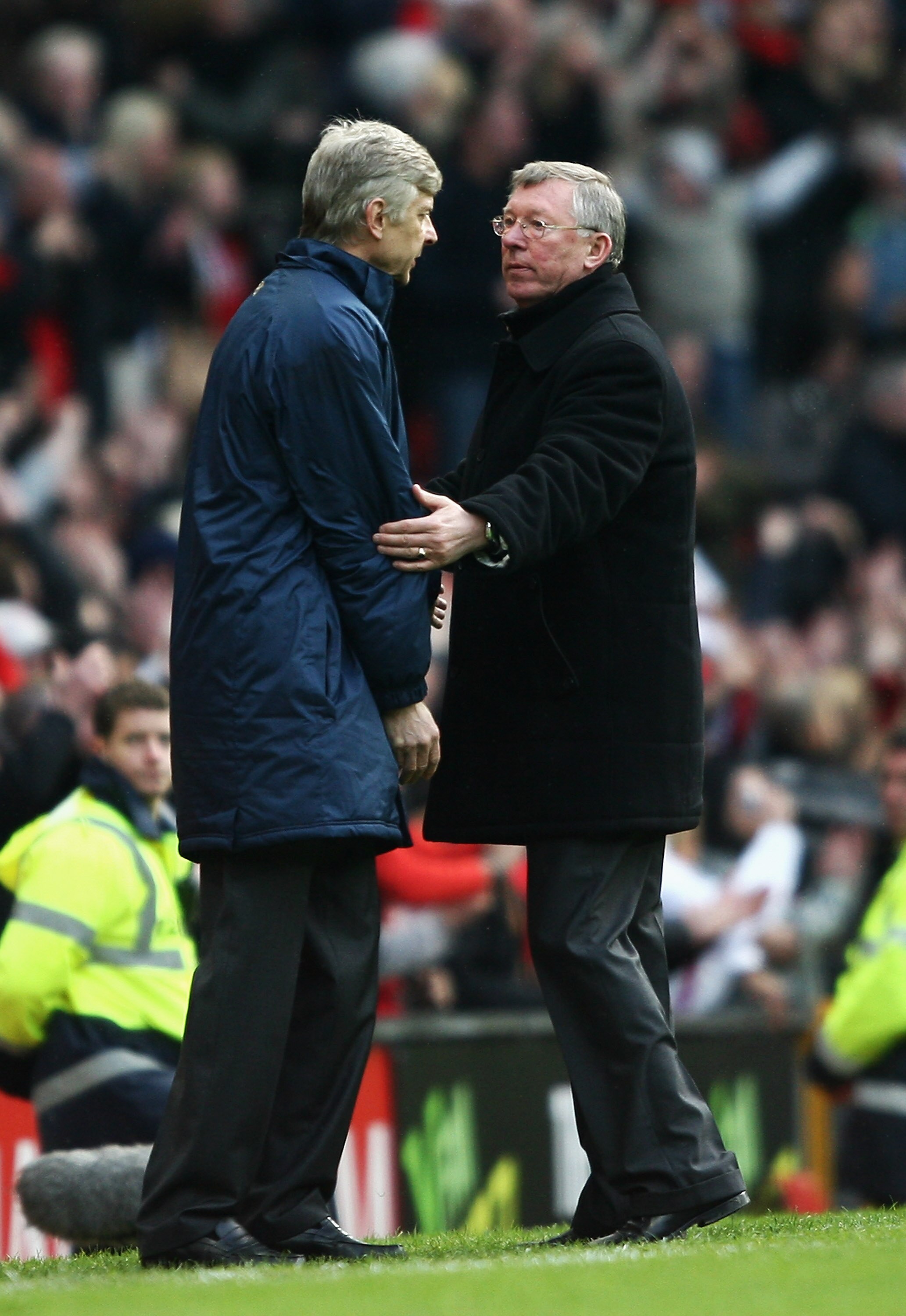 MANCHESTER, UNITED KINGDOM - APRIL 13: Sir Alex Ferguson, manager of Manchester United consoles Arsene Wenger, manager of Arsenal after the Barclays Premier League match between Manchester United and Arsenal at Old Trafford on April 13, 2008 in Mancheste MANCHESTER, UNITED KINGDOM - APRIL 13: Sir Alex Ferguson, manager of Manchester United consoles Arsene Wenger, manager of Arsenal after the Barclays Premier League match between Manchester United and Arsenal at Old Trafford on April 13, 2008 in Mancheste