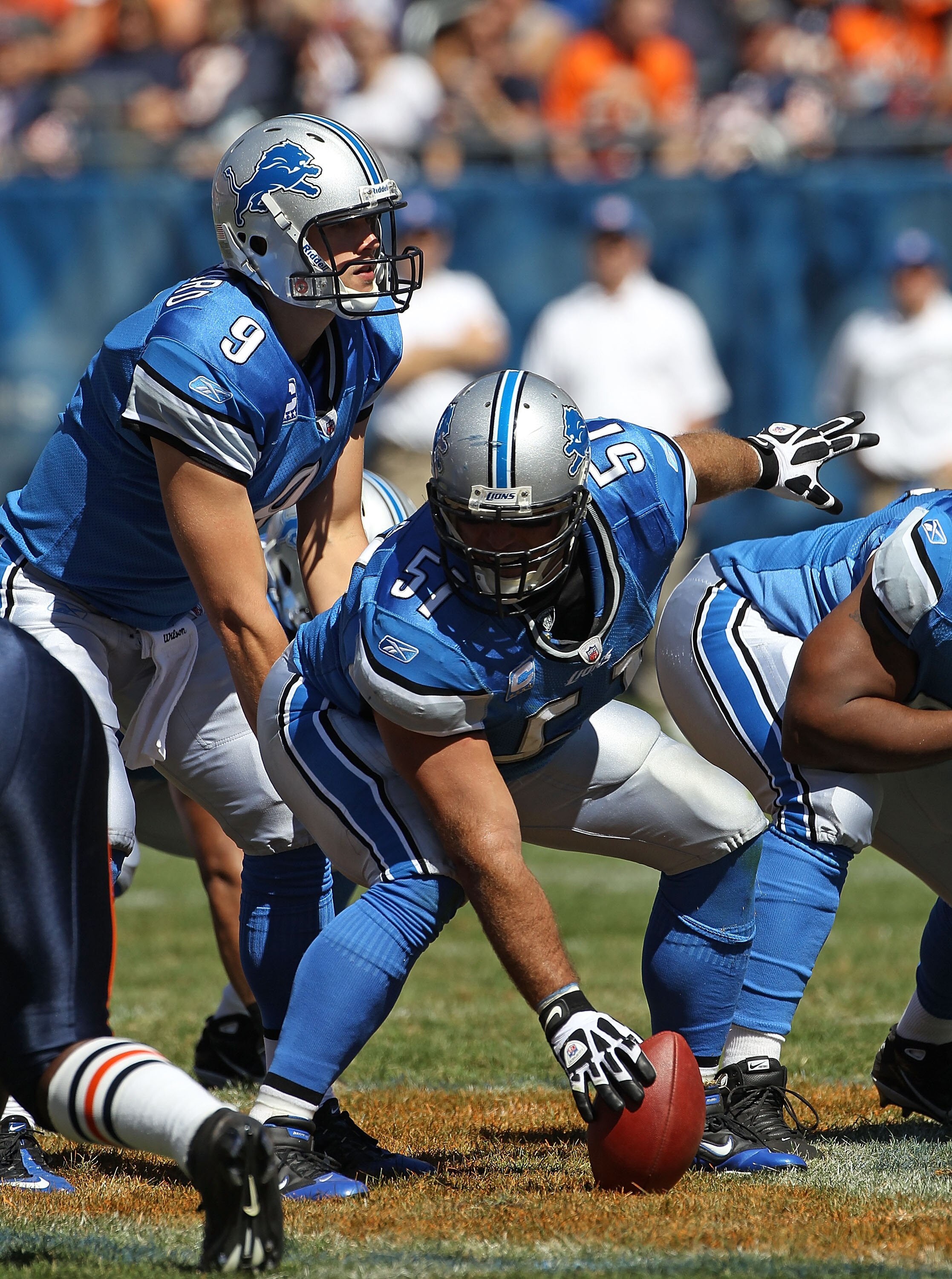 CHICAGO - SEPTEMBER 12: Dominic Raiola #51 of the Detroit Lions prepares to snap the ball to Matthew Stafford #9 during the NFL season opening game against the Chicago Bears at Soldier Field on September 12, 2010 in Chicago, Illinois. The Bears defeated t