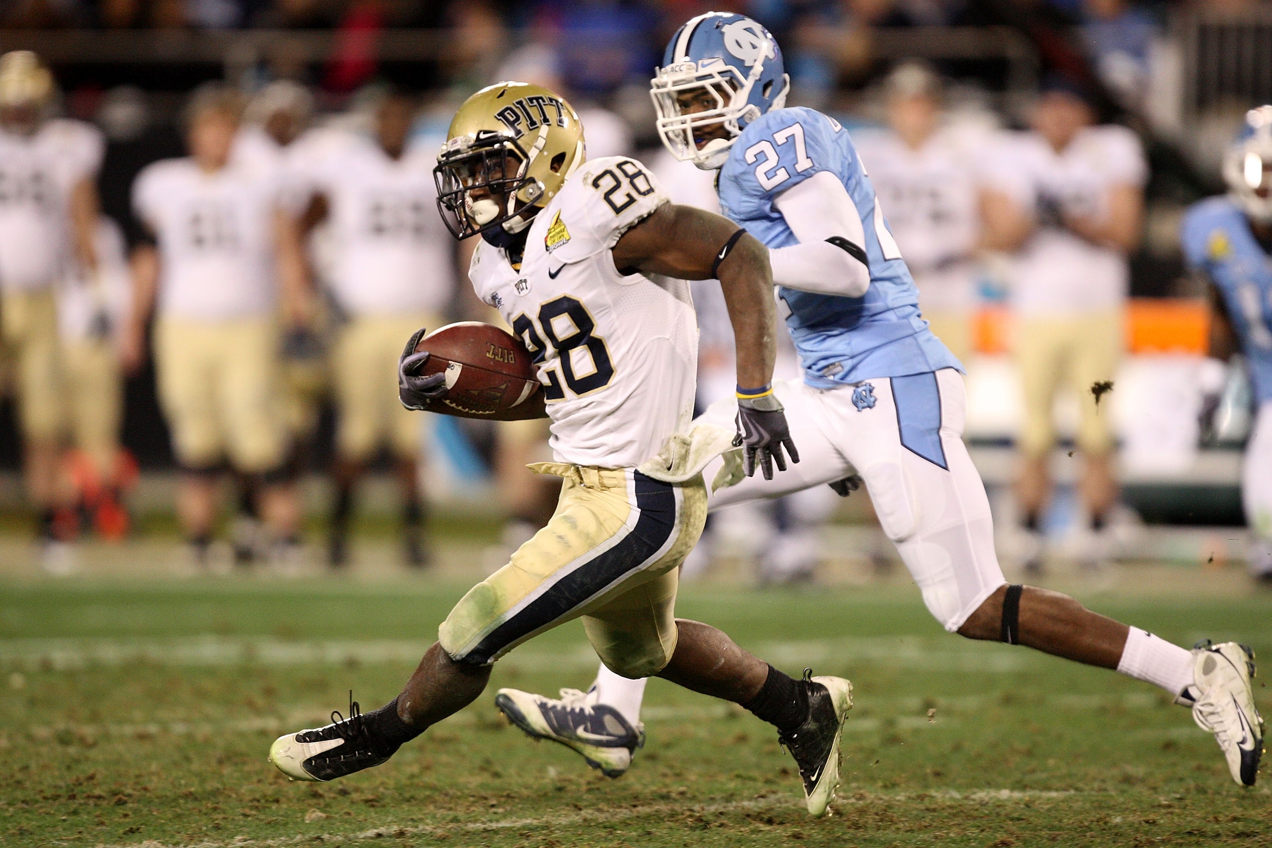 CHARLOTTE, NC - DECEMBER 26: Dion Lewis #28 of the Pittsburgh Panthers runs away from Deunta Williams #27 of the North Carolina Tar Heels during their game on December 26, 2009 in Charlotte, North Carolina. (Photo by Streeter Lecka/Getty Images) CHARLOTTE, NC - DECEMBER 26: Dion Lewis #28 of the Pittsburgh Panthers runs away from Deunta Williams #27 of the North Carolina Tar Heels during their game on December 26, 2009 in Charlotte, North Carolina. (Photo by Streeter Lecka/Getty Images)