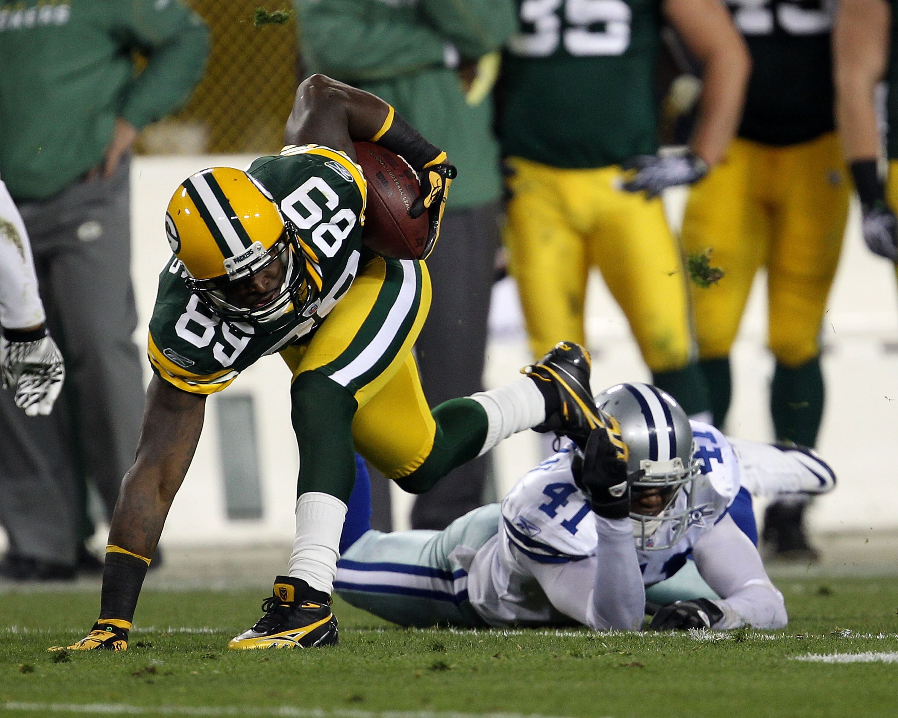GREEN BAY, WI - NOVEMBER 07: James Jones #89 of the Green Bay Packers keeps his balance and runs for a first down as Terence Newman #41 of the Dallas Cowboys misses the tackle at Lambeau Field on November 7, 2010 in Green Bay, Wisconsin.  (Photo by Jonath