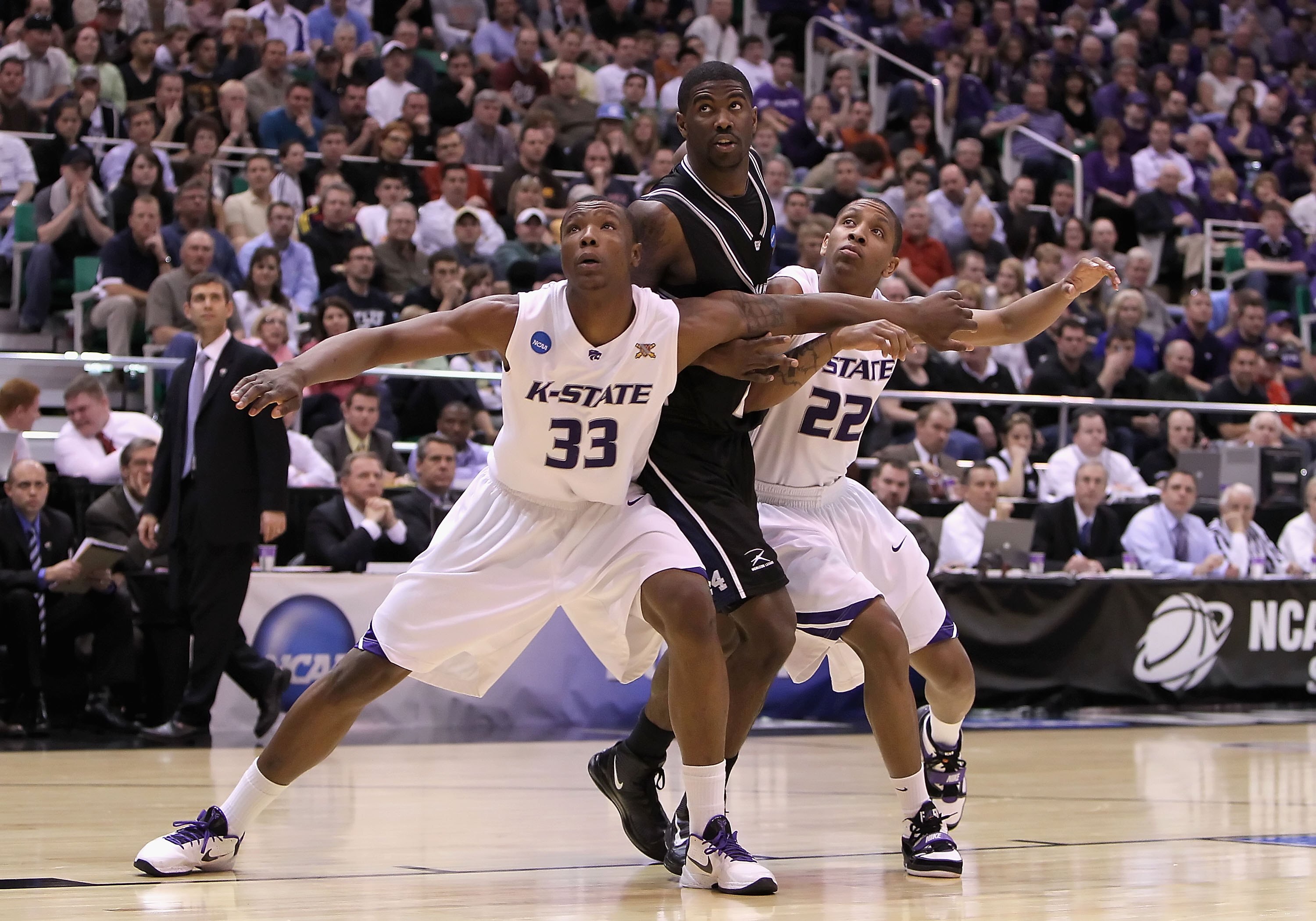 SALT LAKE CITY - MARCH 27: Wally Judge #33 and Rodney McGruder #22 of the Kansas State Wildcats defend the basket against Avery Jukes #24 of the Butler Bulldogs during the west regional final of the 2010 NCAA men's basketball tournament at the Energy Solu