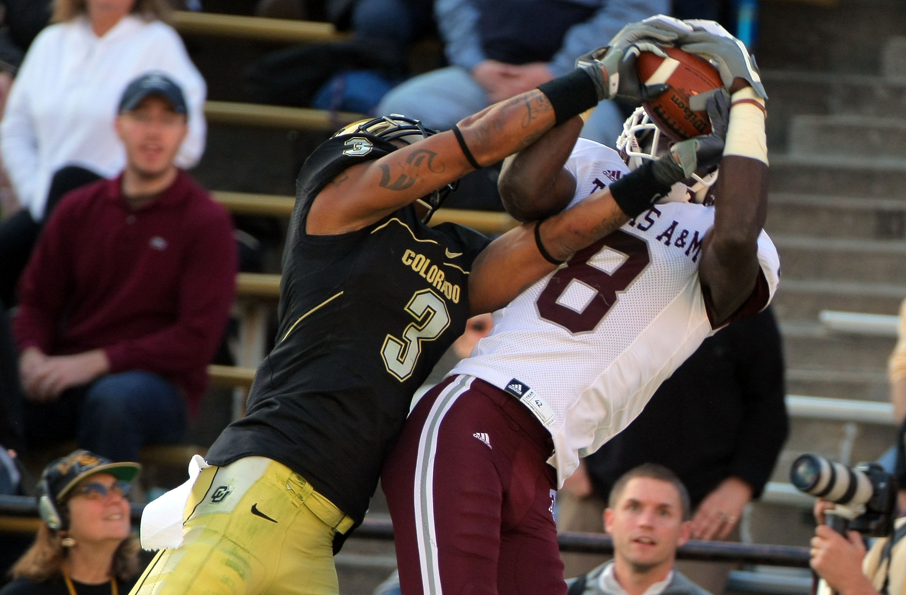 BOULDER, CO - NOVEMBER 07:  Wide receiver Jeff Fuller #8 of the Texas A&M Aggies makes a reception against the defense of Jimmy Smith #3 of the Colorado Buffaloes during NCAA college football action at Folsom Field on November 7, 2009 in Boulder, Colorado