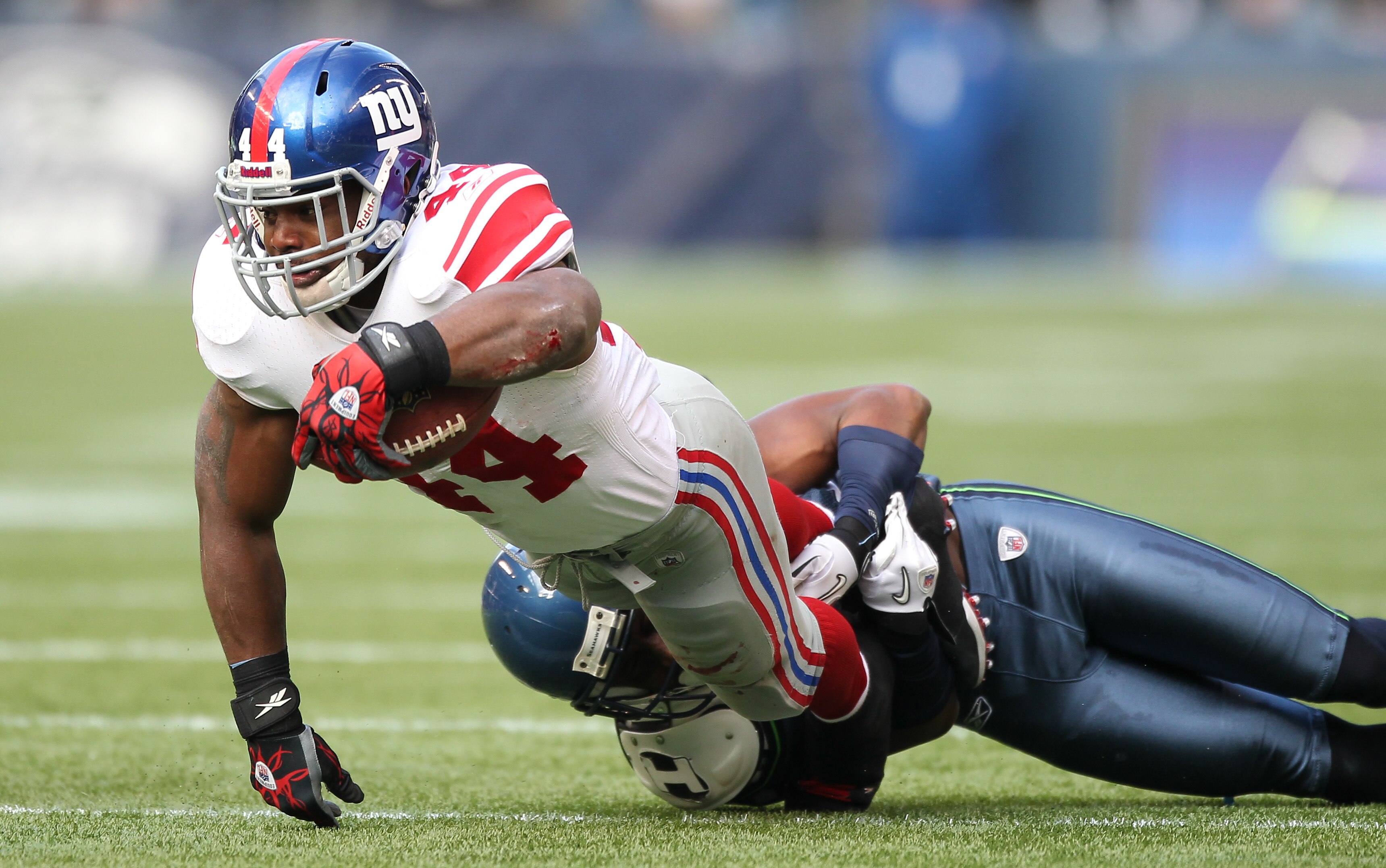 SEATTLE - NOVEMBER 07:  Running back Ahmad Bradshaw #44 of the New York Giants rushes against the Seattle Seahawks at Qwest Field on November 7, 2010 in Seattle, Washington. The Giants defeated the Seahawks 41-7. (Photo by Otto Greule Jr/Getty Images)