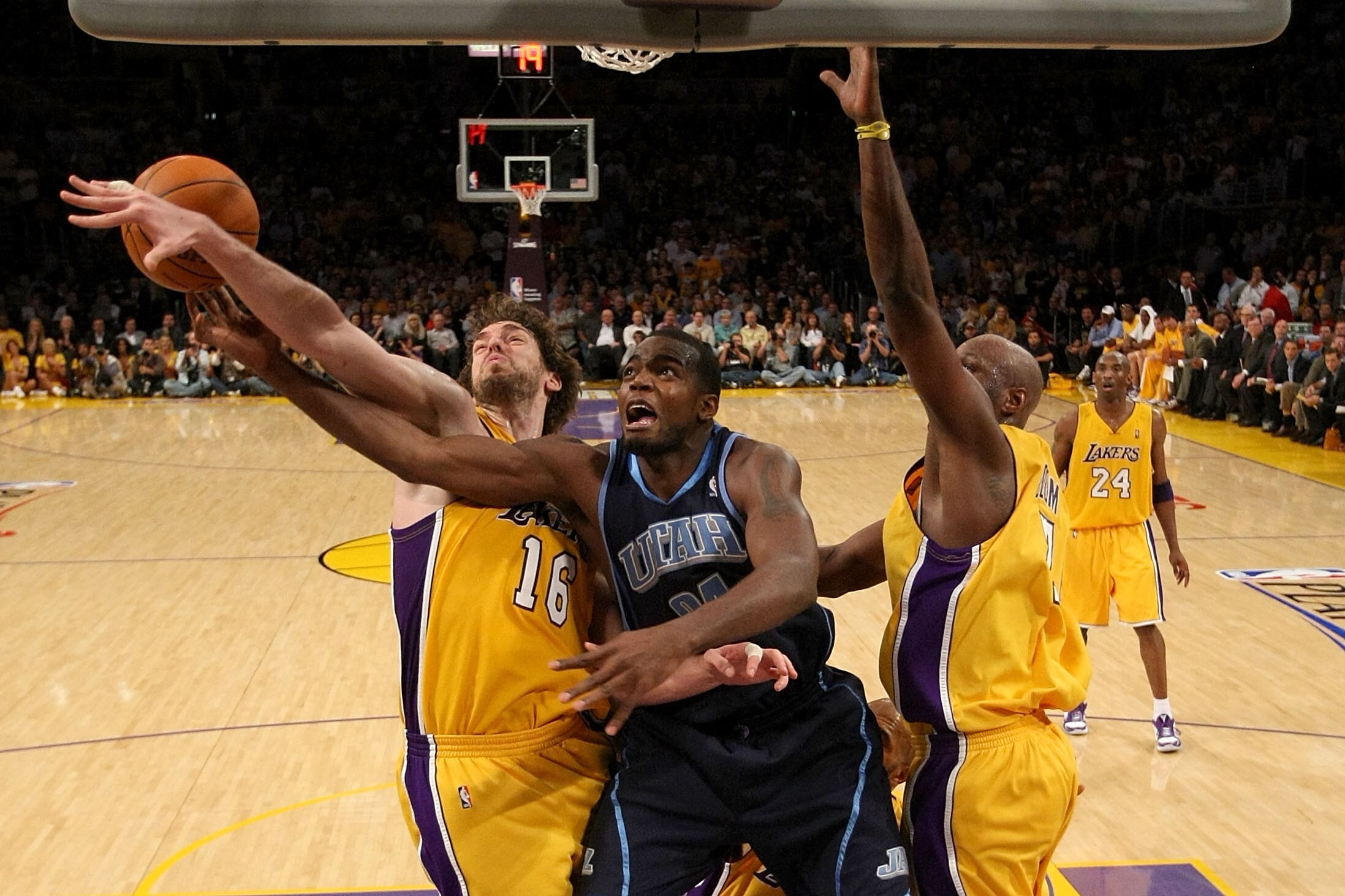 LOS ANGELES, CA - MAY 04:  Paul Millsap #24 of the Utah Jazz is blocked by Pau Gasol #16 of the Los Angeles Lakers in the fourth quarter during Game Two of the Western Conference Semifinals of the 2010 NBA Playoffs at Staples Center on May 4, 2010 in Los