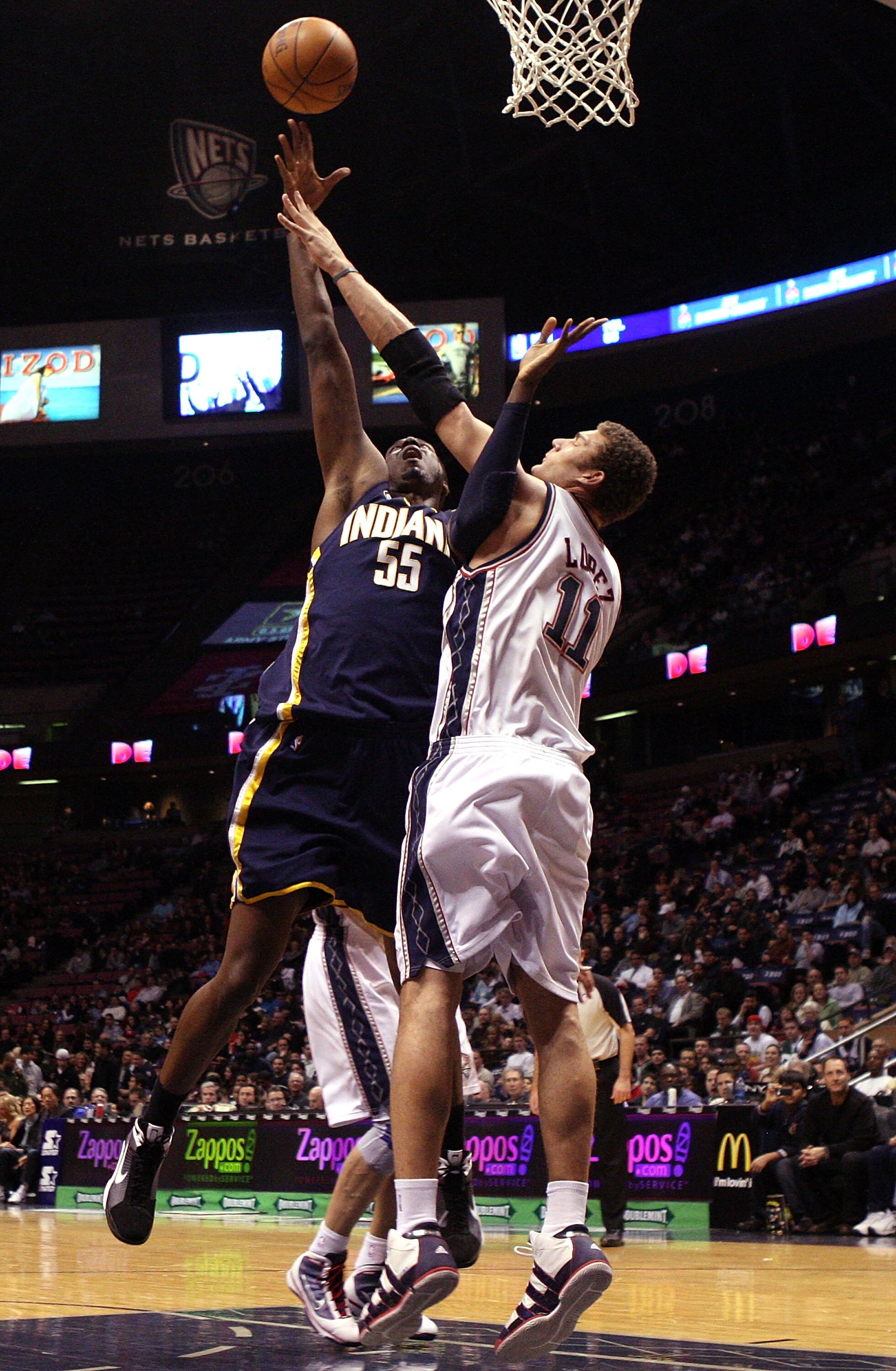 EAST RUTHERFORD, NJ - JANUARY 15:  Roy Hibbert #55 of the Indiana Pacers shoots against Brook Lopez #11 of the New Jersey Nets at the Izod Center on January 15, 2010 in East Rutherford, New Jersey. NOTE TO USER: User expressly acknowledges and agrees that