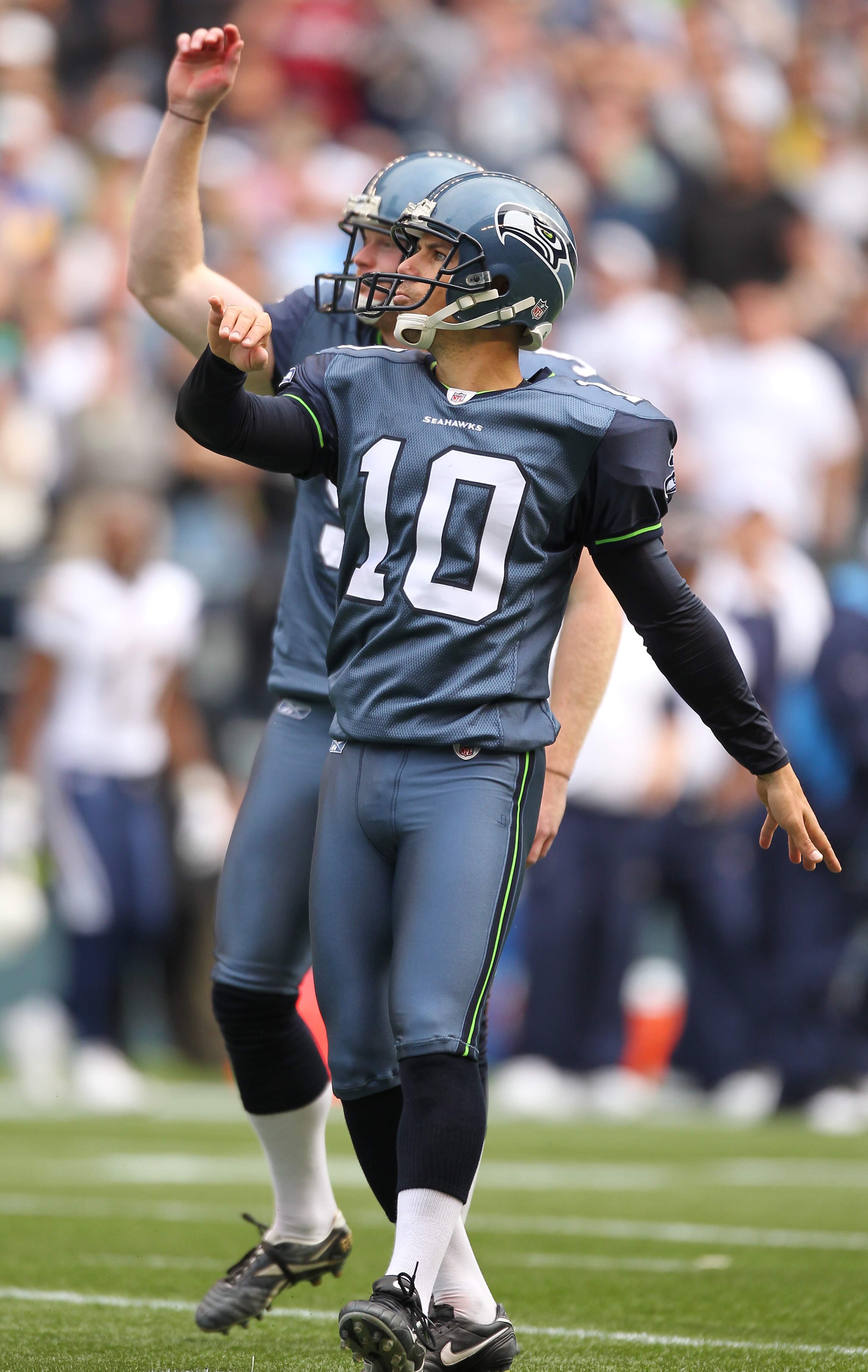 SEATTLE - SEPTEMBER 26:  Kicker Olindo Mare #10 and holder Jon Ryan #9 of the Seattle Seahawks watch the flight of a field goal against the San Diego Chargers at Qwest Field on September 26, 2010 in Seattle, Washington. (Photo by Otto Greule Jr/Getty Imag