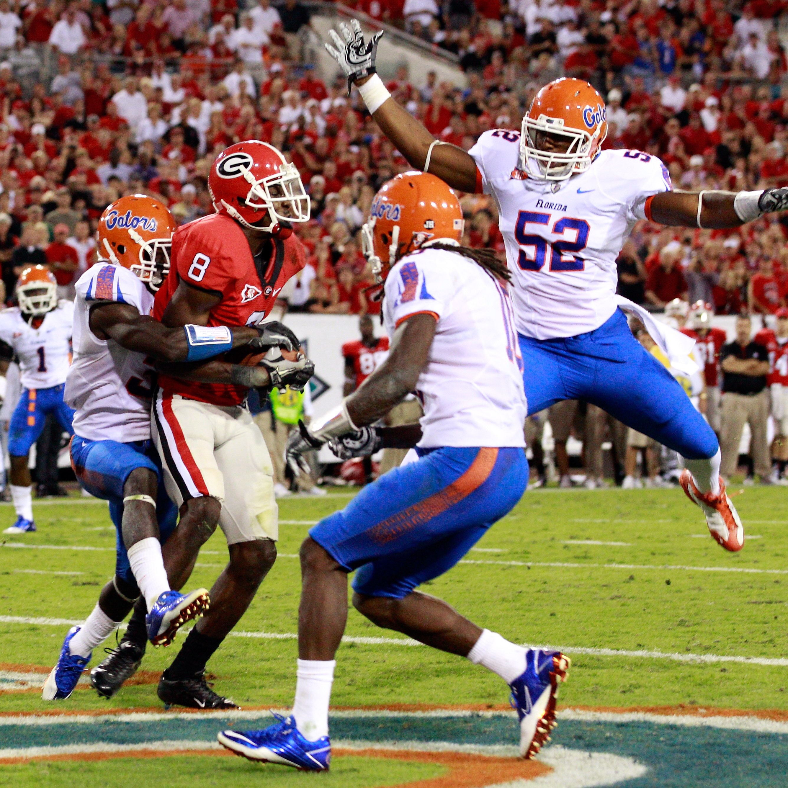 JACKSONVILLE, FL - OCTOBER 30: A.J. Green #8 of the Georgia Bulldogs catches a pass for a touchdown against Jonathan Bostic #52 of the Florida Gators during the game at EverBank Field on October 30, 2010 in Jacksonville, Florida. (Photo by Sam Greenwood JACKSONVILLE, FL - OCTOBER 30: A.J. Green #8 of the Georgia Bulldogs catches a pass for a touchdown against Jonathan Bostic #52 of the Florida Gators during the game at EverBank Field on October 30, 2010 in Jacksonville, Florida. (Photo by Sam Greenwood
