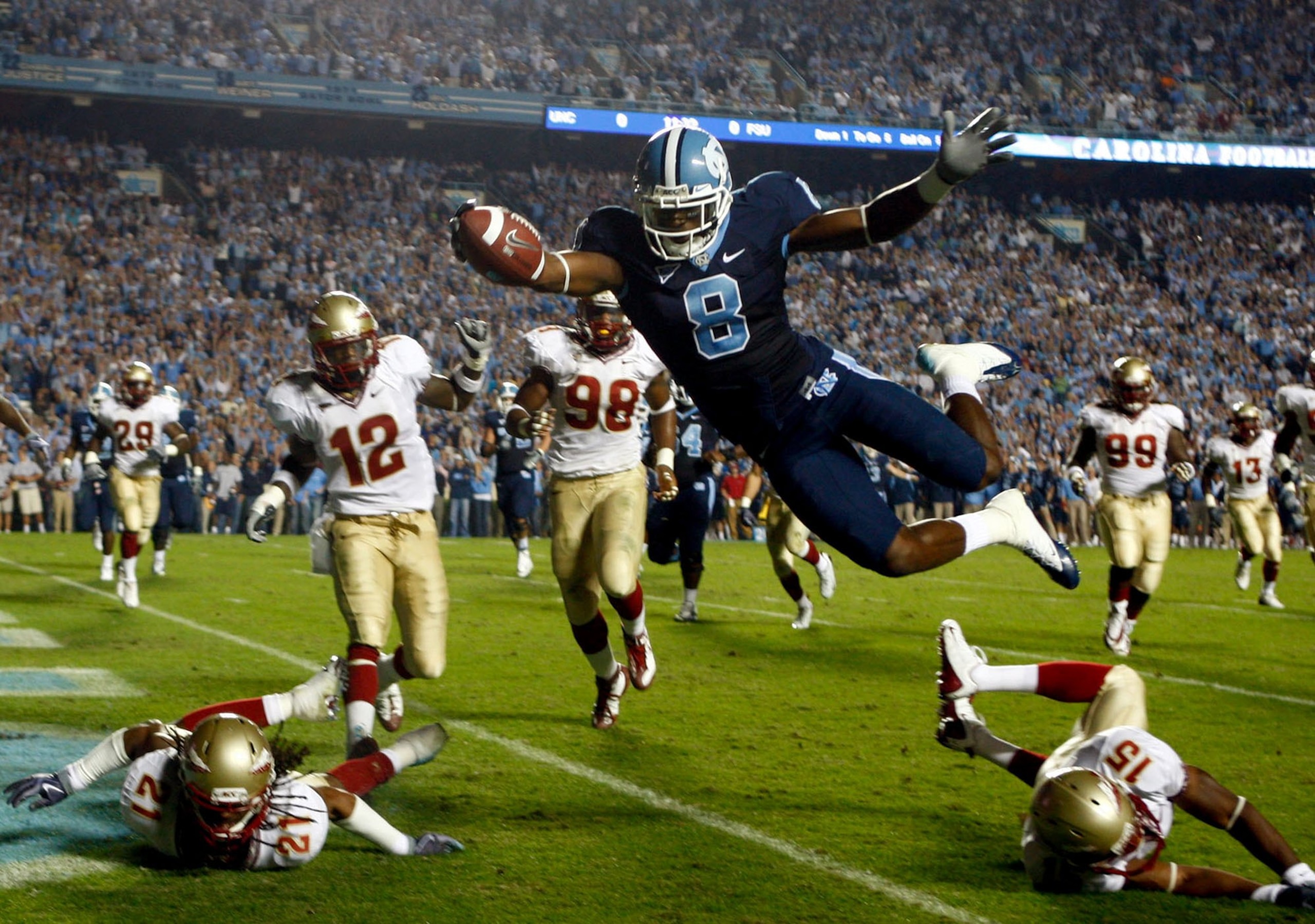 CHAPEL HILL, NC - OCTOBER 22: Greg Little #8 of the North Carolina Tar Heels dives past Florida State Seminole defenders for a first quarter touchdown at Kenan Stadium on October 22, 2009 in Chapel Hill, North Carolina. (Photo by Scott Halleran/Getty Im CHAPEL HILL, NC - OCTOBER 22: Greg Little #8 of the North Carolina Tar Heels dives past Florida State Seminole defenders for a first quarter touchdown at Kenan Stadium on October 22, 2009 in Chapel Hill, North Carolina. (Photo by Scott Halleran/Getty Im