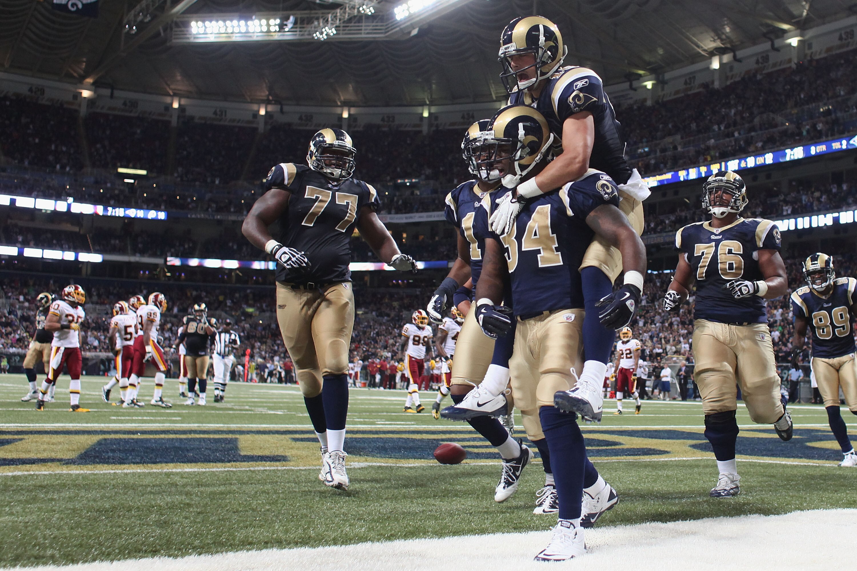 ST. LOUIS - SEPTEMBER 26: Kenneth Darby #34 of the St. Louis Rams is congratulated by teammate Danny Amendola #16 after scoring a touchdown against the Washington Redskins at the Edward Jones Dome on September 26, 2010 in St. Louis, Missouri.  The Rams be