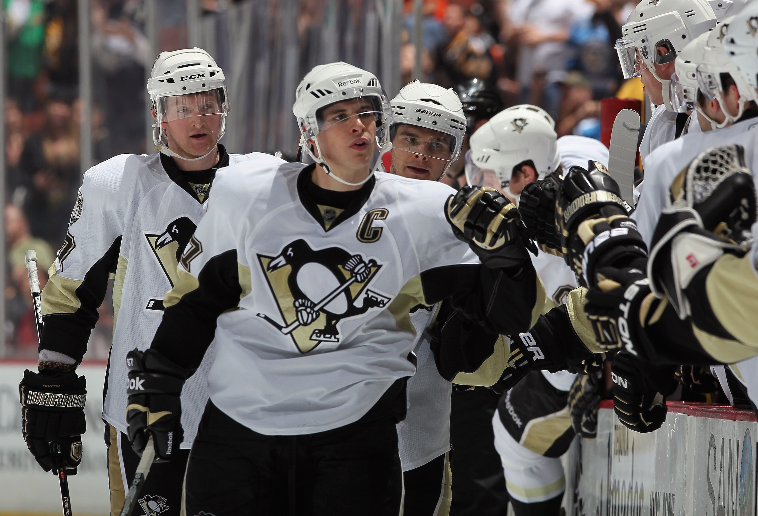 ANAHEIM, CA - NOVEMBER 05:  Sidney Crosby #87 of the Pittsburgh Penguins receives high fives from the bench after scoring a goal against the Anaheim Ducks in the third period at the Honda Center on November 5, 2010 in Anaheim, California. The Ducks defeat