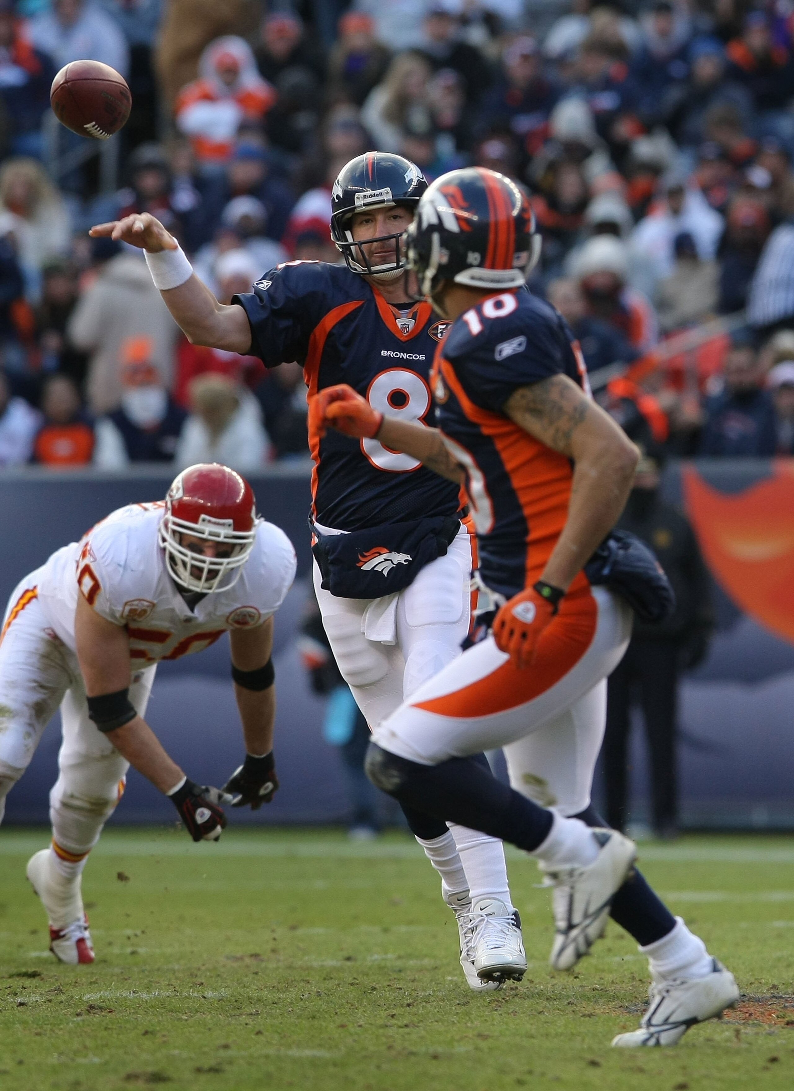 DENVER - JANUARY 03:  Quarterback Kyle Orton #8 of the Denver Broncos delivers a pass to wide receiver Jabar Gaffney #10 against the Kansas City Chiefs during NFL action at Invesco Field at Mile High on January 3, 2010 in Denver, Colorado. The Chiefs defe