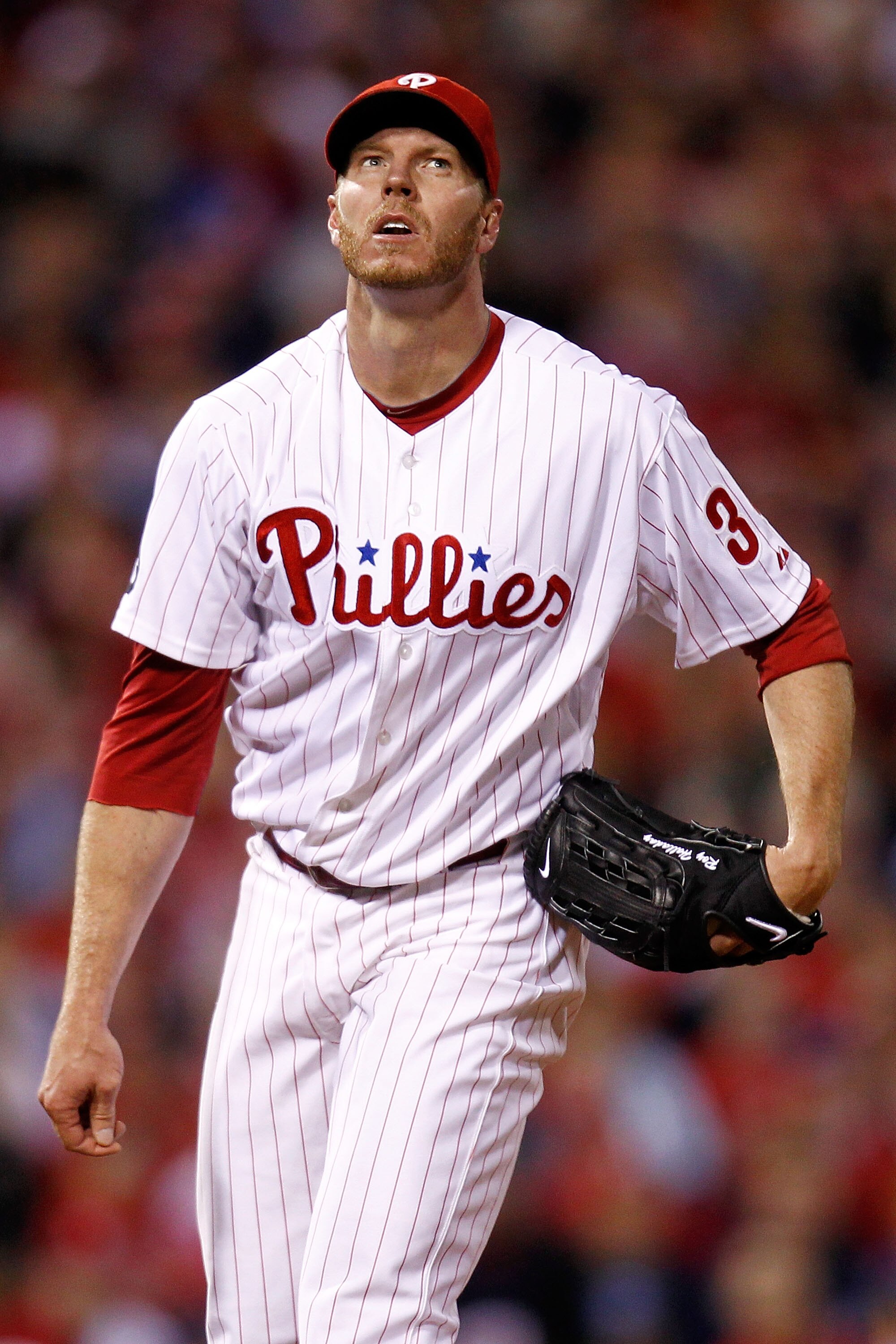 PHILADELPHIA - OCTOBER 16:  Roy Halladay #34 of the Philadelphia Phillies looks up after throwing a pitch in the first inning against the San Francisco Giants in Game One of the NLCS during the 2010 MLB Playoffs at Citizens Bank Park on October 16, 2010 i