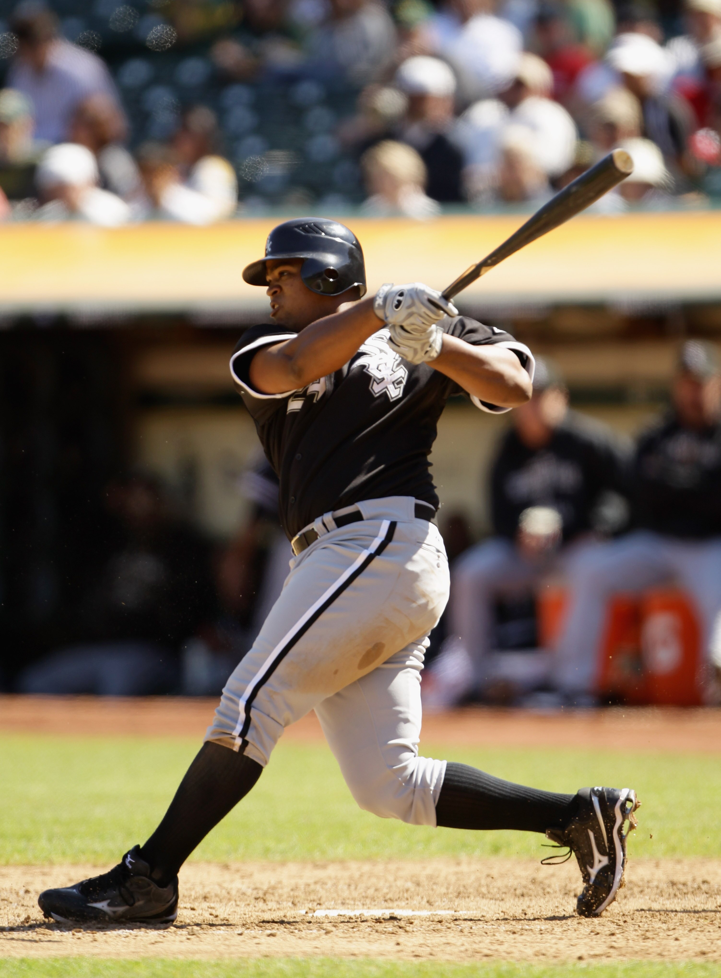 OAKLAND, CA - SEPTEMBER 22:  Dayan Viciedo #24 of the Chicago White Sox hits a single to score Carlos Quentin #20 in the seventh inning against the Oakland Athletics at the Oakland-Alameda County Coliseum on September 22, 2010 in Oakland, California.  (Ph