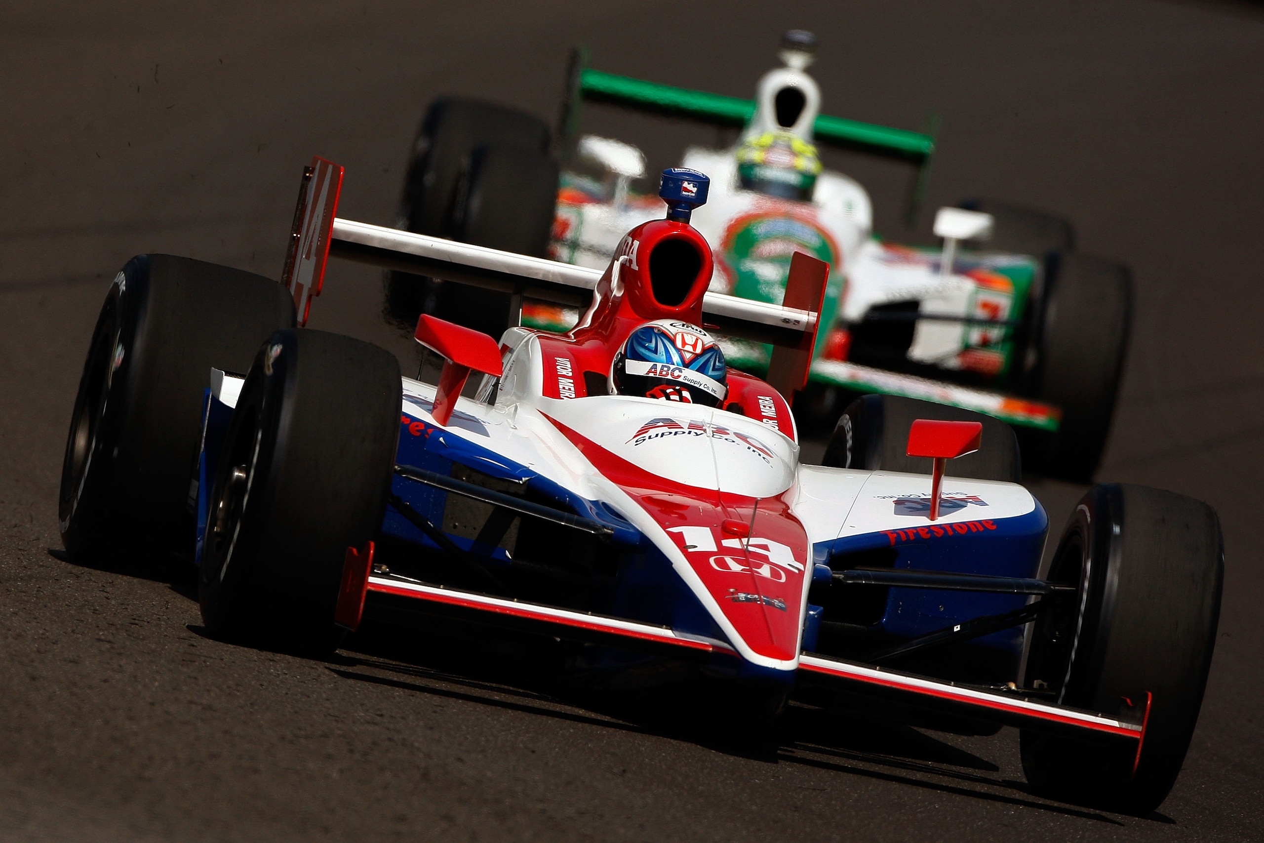 INDIANAPOLIS - MAY 22:  Vitor Meira drives in the #14 ABC Supply Co AJ Foyt Racing Dallara Honda ahead of Tony Kanaan in the #11 Team 7-Eleven Andretti Green Racing Dallara Honda during Miller Lite Carb Day practice for the IRL IndyCar Series 93rd running