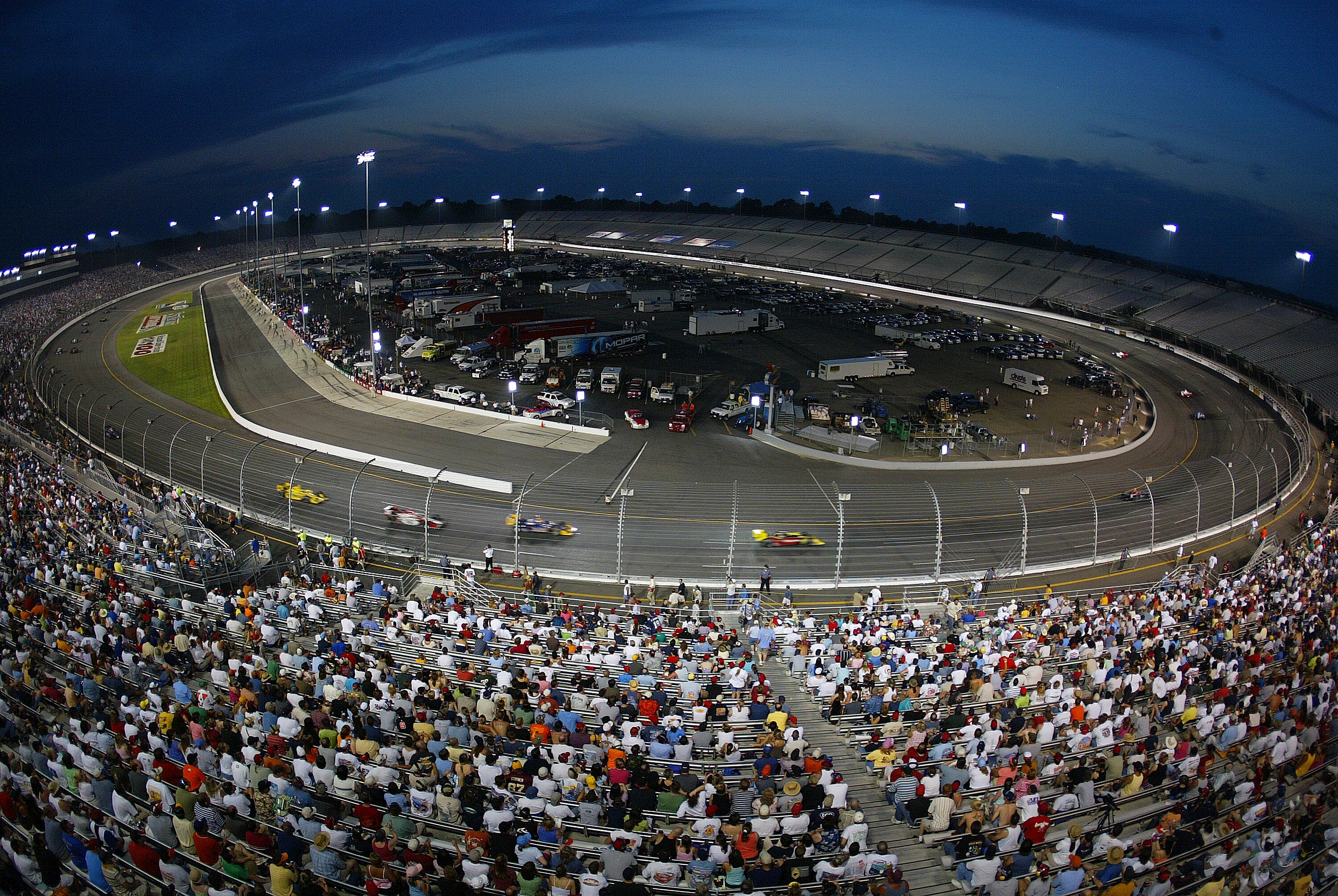 RICHMOND, VA - JUNE 25:  The field make their way around the three-quarter mile oval during the Indy Racing League SunTrust Indy Challenge on June 25, 2005 at the Richmond International Raceway, Richmond.  (Photo by Gavin Lawrence/Getty Images)