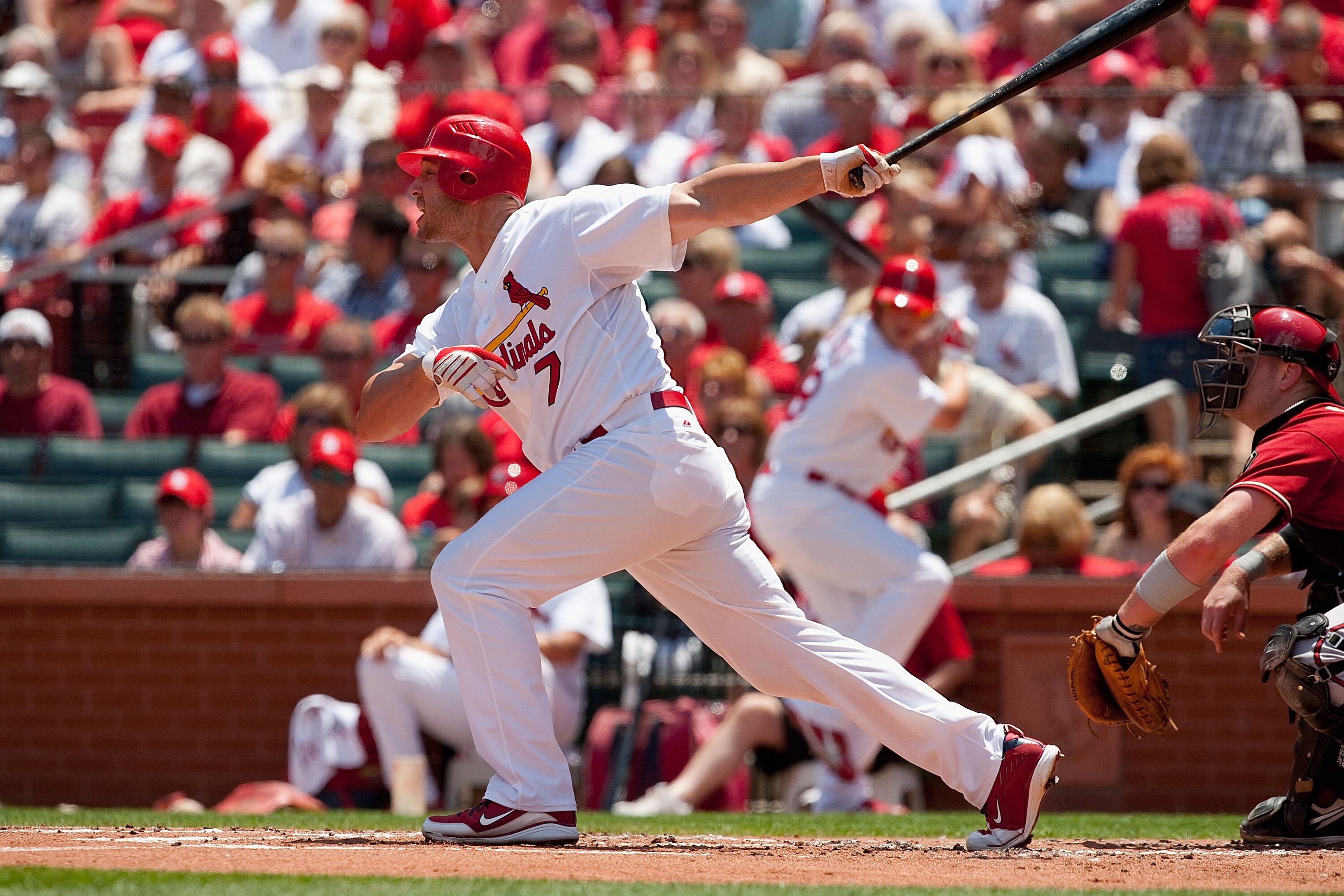 ST. LOUIS - JUNE 30: Matt Holliday #7 of the St. Louis Cardinals hits an RBI triple against the Arizona Diamondbacks at Busch Stadium on June 30, 2010 in St. Louis, Missouri.  (Photo by Dilip Vishwanat/Getty Images)