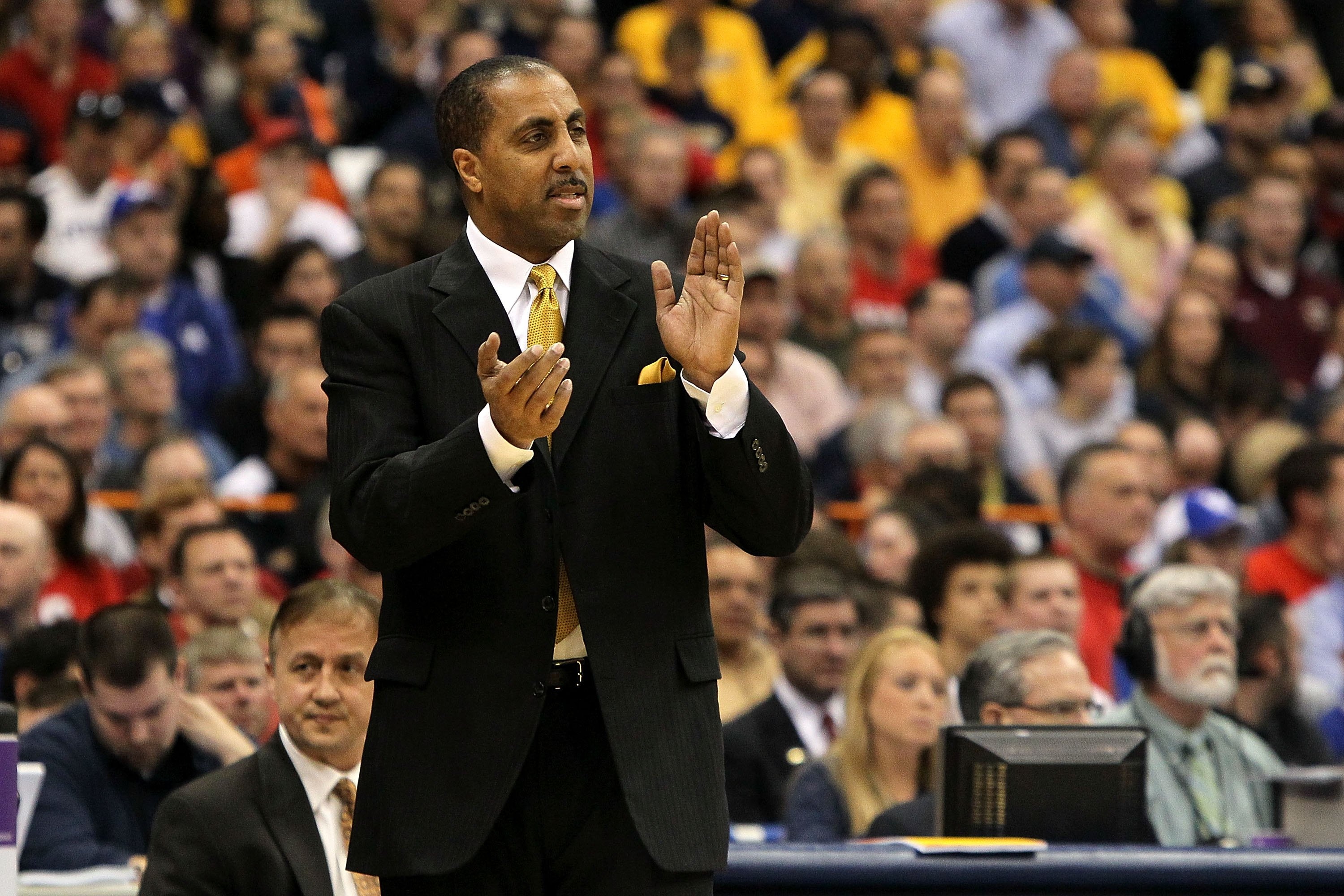 SYRACUSE, NY - MARCH 25:  Head coach Lorenzo Romar of the Washington Huskies coaches against the West Virginia Mountaineers during the east regional semifinal of the 2010 NCAA men's basketball tournament at the Carrier Dome on March 25, 2010 in Syracuse,