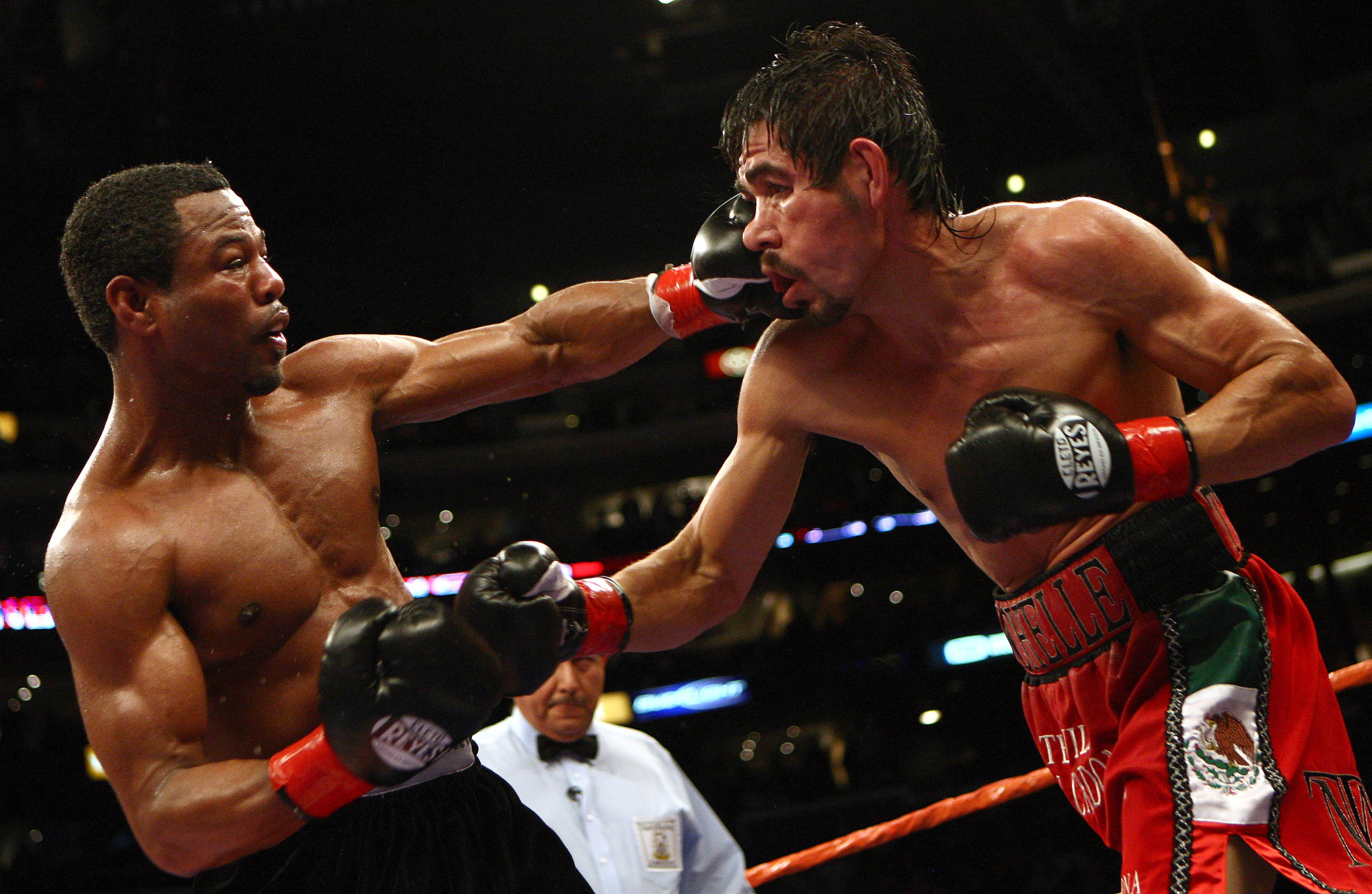 LOS ANGELES - JANUARY 24:   Shane Mosley lands a punch on Antonio Margarito en route to his TKO in the ninth round after Margarito's corner threw in the towel during their WBA welterweight title fight on January 24, 2009 at the Staples Center in Los Angel