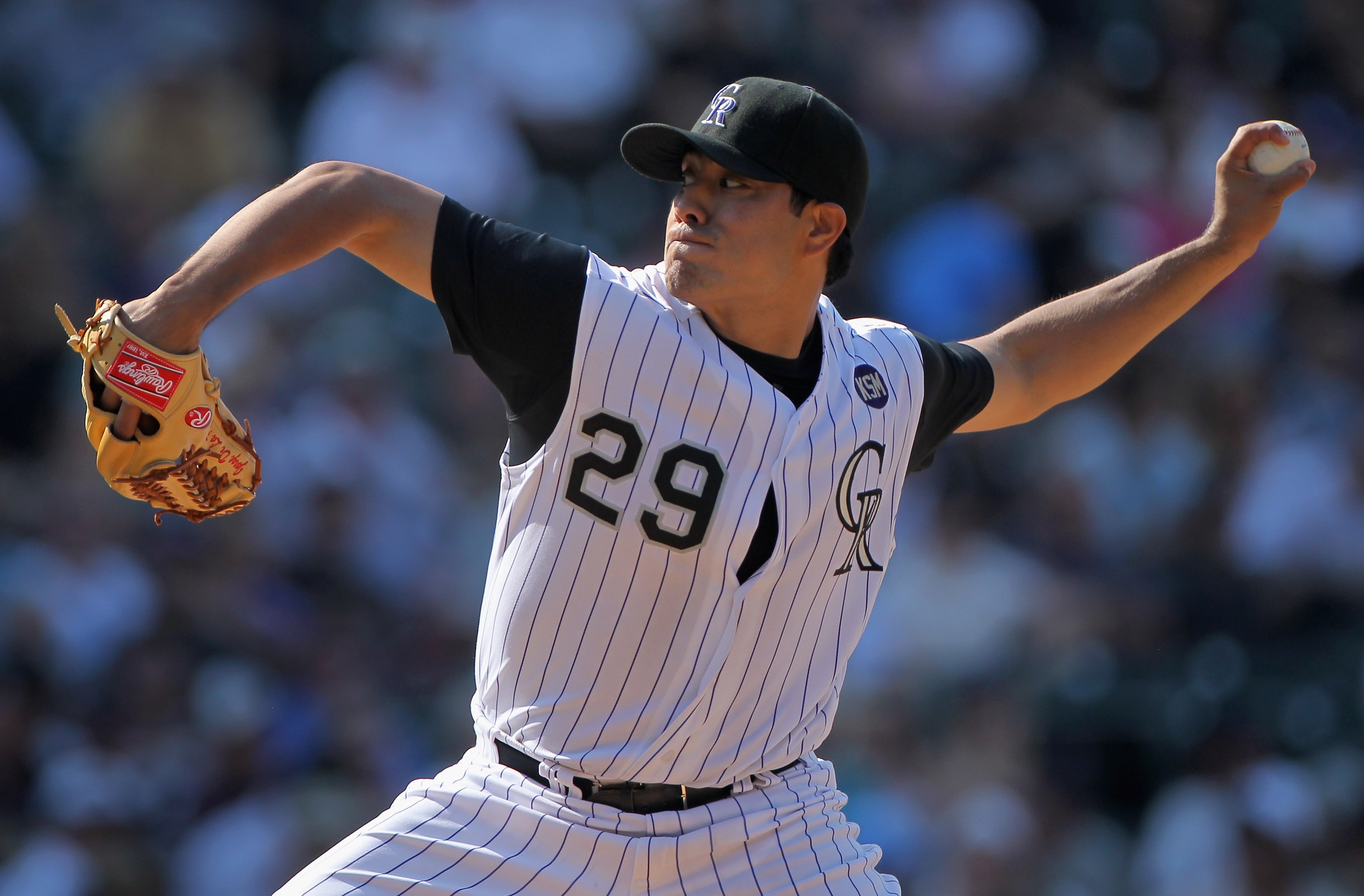 DENVER - SEPTEMBER 15:  Starting pitcher Jorge De La Rosa #29 of the Colorado Rockies delivers against the San Diego Padres at Coors Field on September 15, 2010 in Denver, Colorado. De La Rosa collected the win as the Rockies defeated the Padres 9-6.  (Ph
