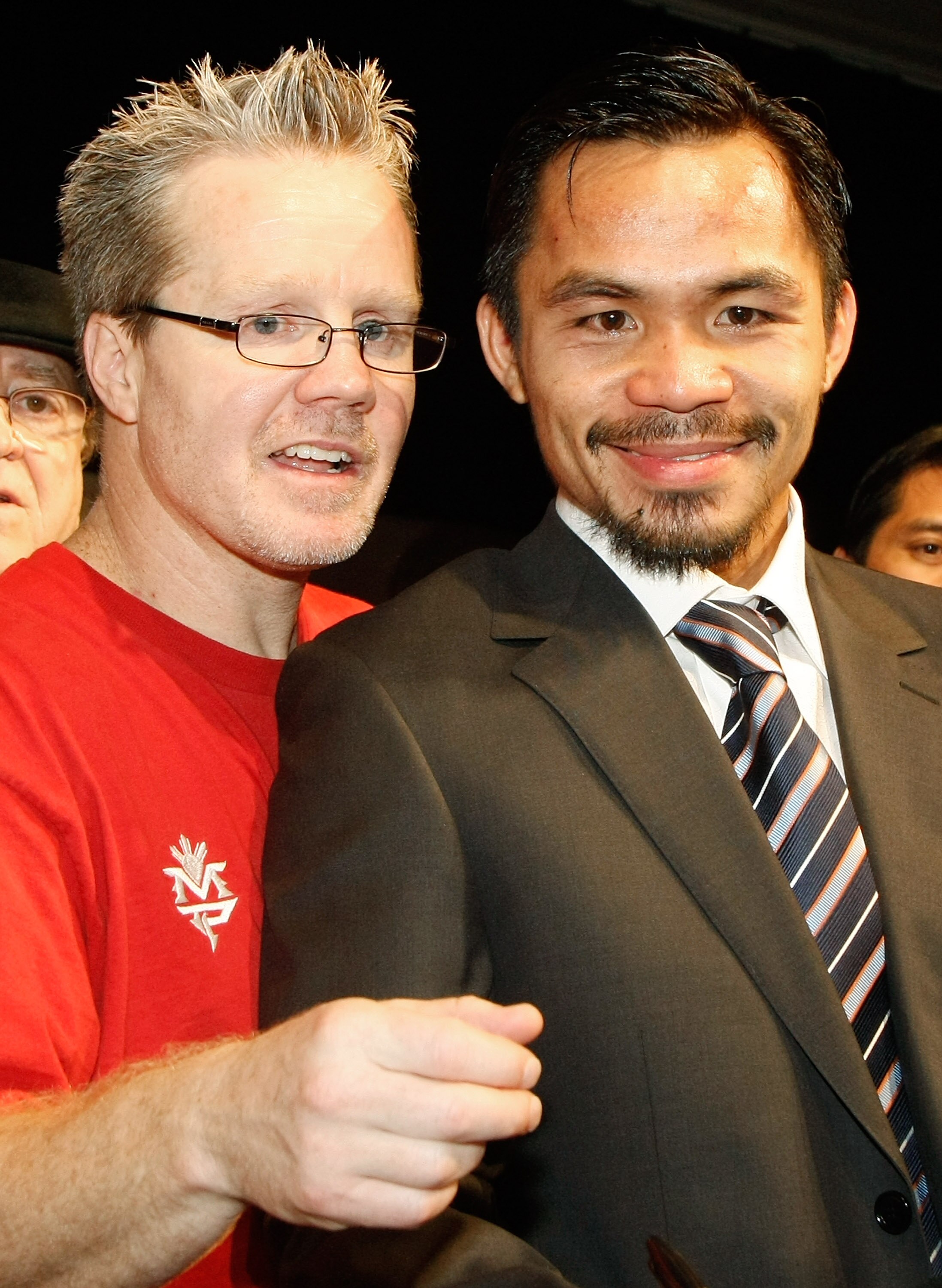 LAS VEGAS - DECEMBER 06:  Manny Pacquiao (R) of the Philippines and his trainer Freddie Roach appear at a news conference following Pacquiao's victory over Oscar De La Hoya in their welterweight bout at the MGM Grand Garden Arena December 6, 2008 in Las V