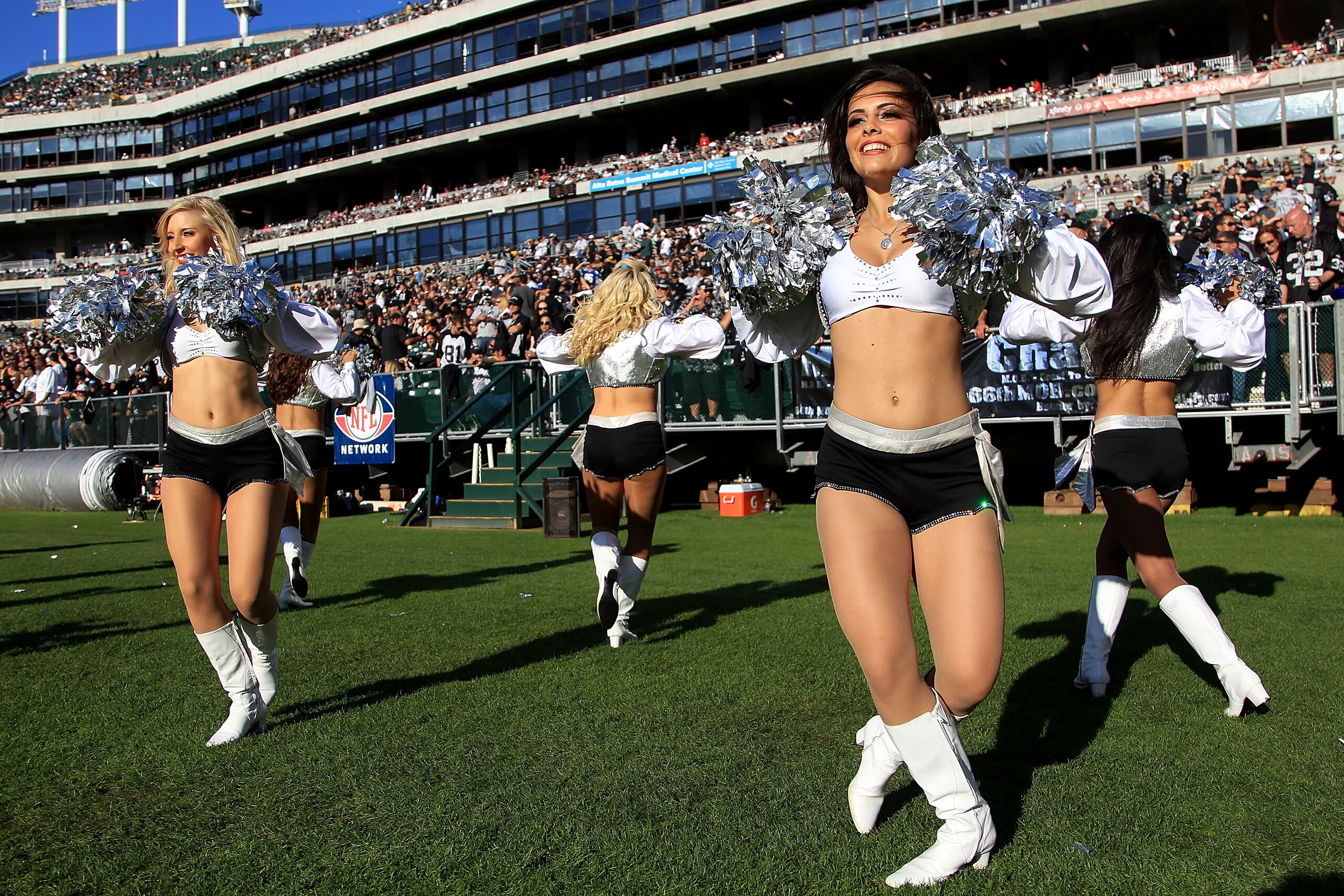 OAKLAND, CA - OCTOBER 31:  The Raiderettes cheer for their team during the Seattle Seahawks game against the Oakland Raiders at Oakland-Alameda County Coliseum on October 31, 2010 in Oakland, California.  (Photo by Ezra Shaw/Getty Images)