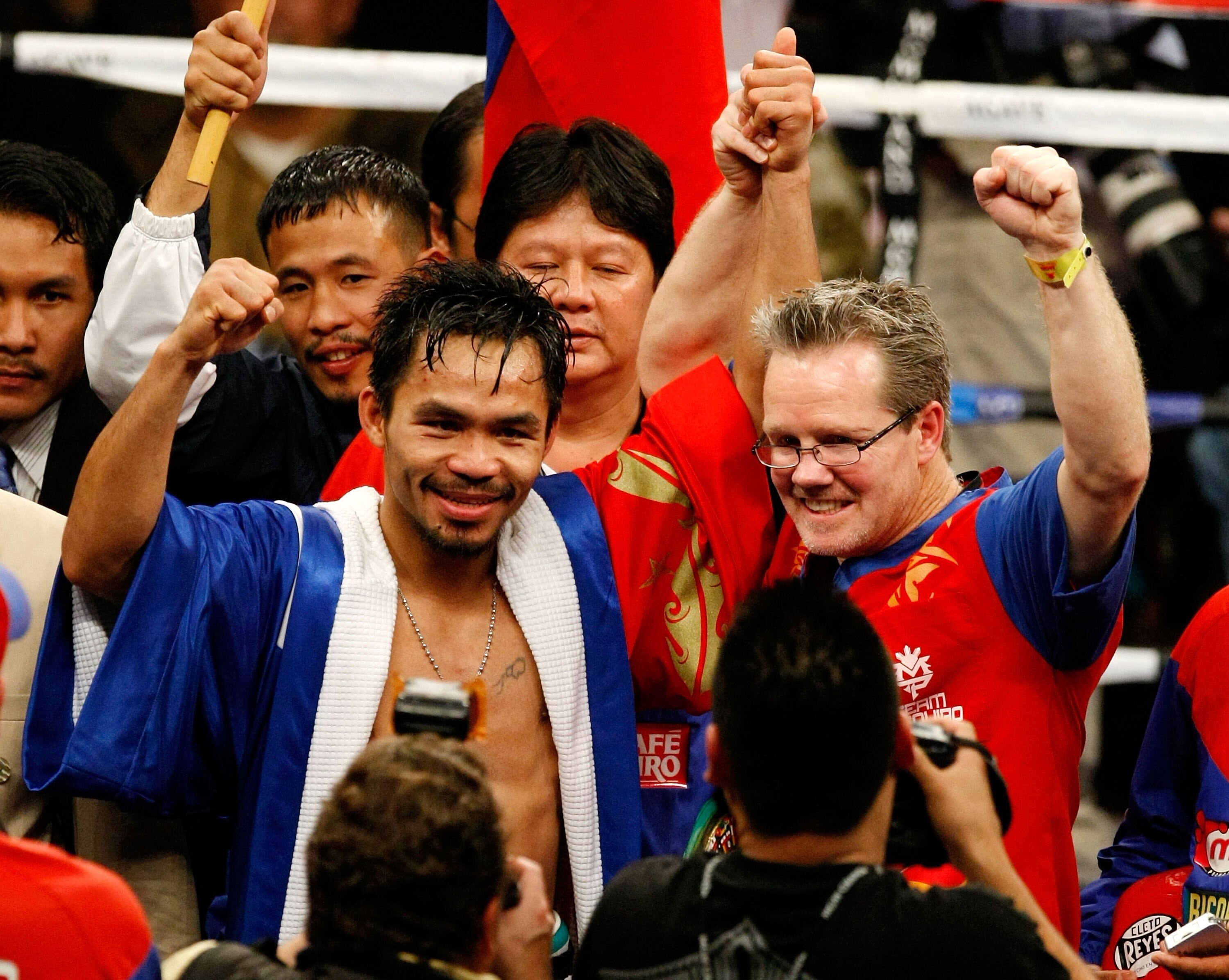 LAS VEGAS - DECEMBER 06:  (L-R) Manny Pacquiao of the Philippines celebrates with his trainer Freddie Roach after defeating Oscar De La Hoya in their welterweight fight at the MGM Grand Garden Arena December 6, 2008 in Las Vegas, Nevada.  (Photo by Ethan
