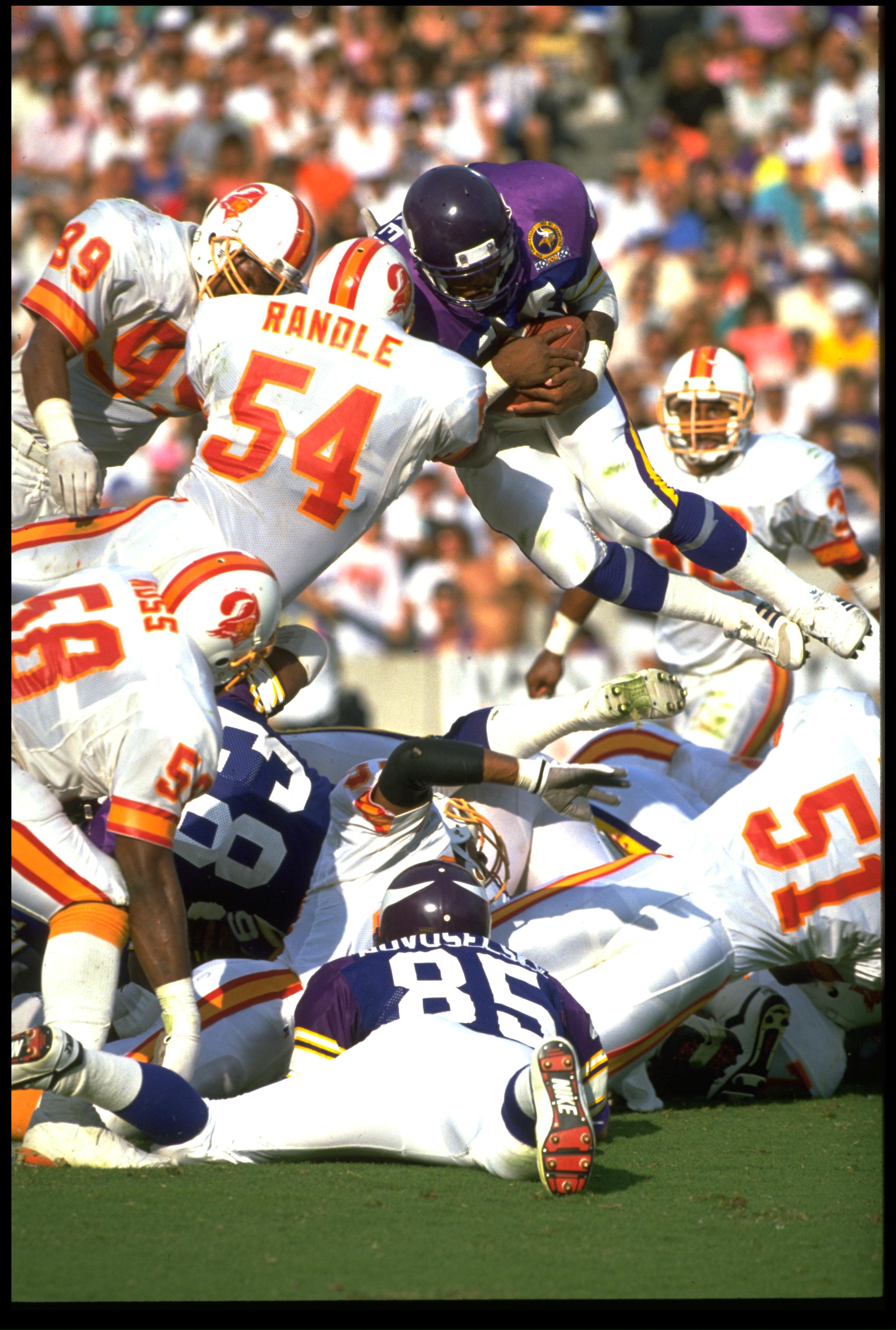 12 NOV 1989:  MINNESOTA VIKINGS RUNNING BACK HERSCHEL WALKER LEAPS FOR THE ENDZONE DURING THE VIKINGS 24-10 WIN OVER THE TAMPA BAY BUCCANEERS AT TAMPA STADIUM IN TAMPA BAY, FLORIDA.  MANDATORY CREDIT:  SCOTT HALLERAN /ALLSPORT