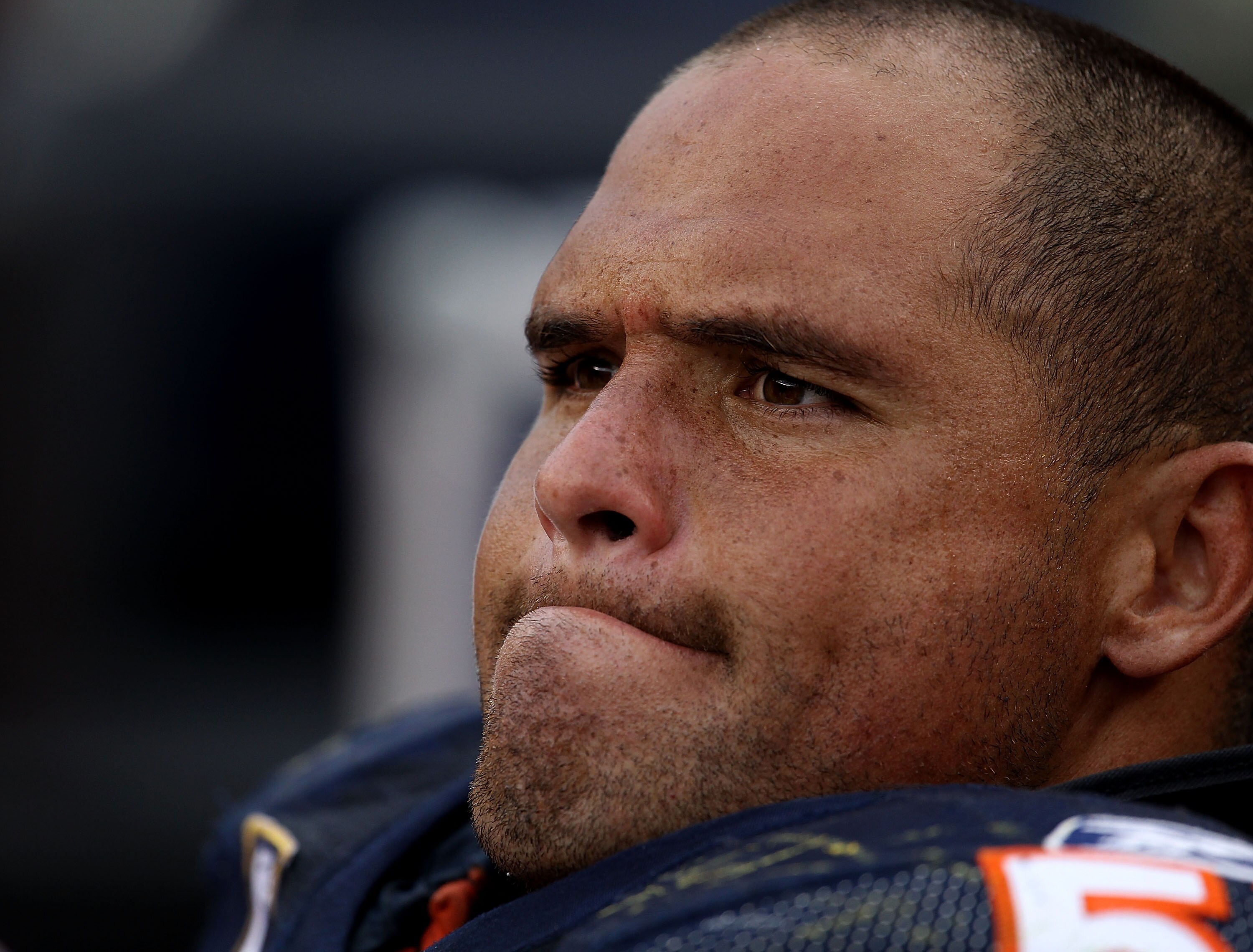 CHICAGO - OCTOBER 24: Olin Kreutz #57 of the Chicago Bears sits on the bench with teammates at the end of a game against the Washington Redskins at Soldier Field on October 24, 2010 in Chicago, Illinois. The Redskins defeated the Bears 17-14.  (Photo by J